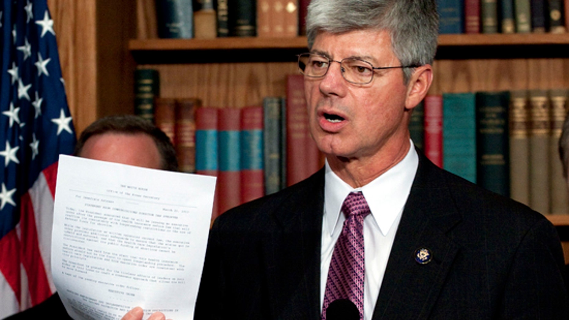 FILE: Rep. Bart Stupak, D-Mich., holds up an executive order to be signed by President Obama reaffirming a ban on the use of federal funds to provide abortions, an order Stupak wanted in exchange for his vote to pass the health insurance overhaul. (AP Photo)