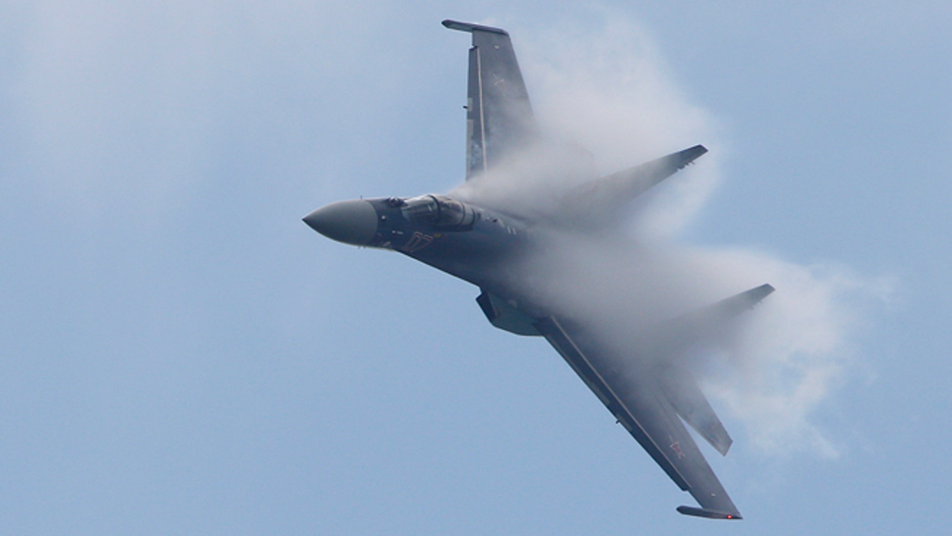A Sukhoi Su-35 fighter aircraft takes part in a flying display, during the 50th Paris Air Show, at the Le Bourget airport near Paris, June 20, 2013.