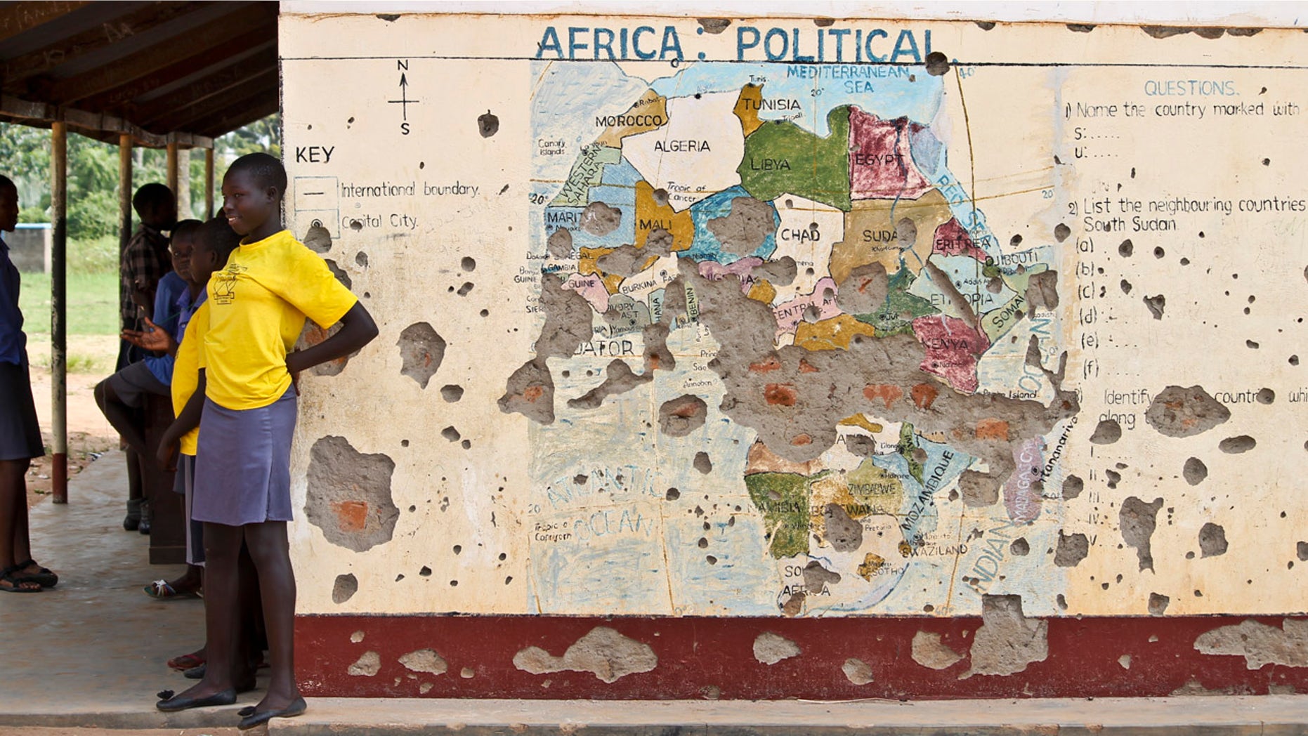 Nov. 15, 2016: Students line up outside a classroom with a map of Africa on its wall, in Yei, in southern South Sudan.