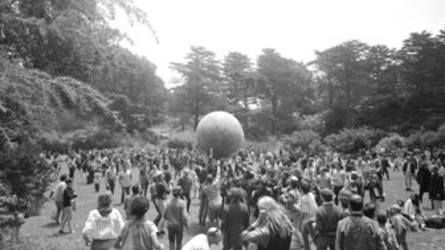 People celebrating the summer solstice on June 21, 1967, carry a large ball, painted to represent a world globe, in the air during a gathering at Golden Gate Park in San Francisco on Day One of "Summer of Love." (AP Photo/File)