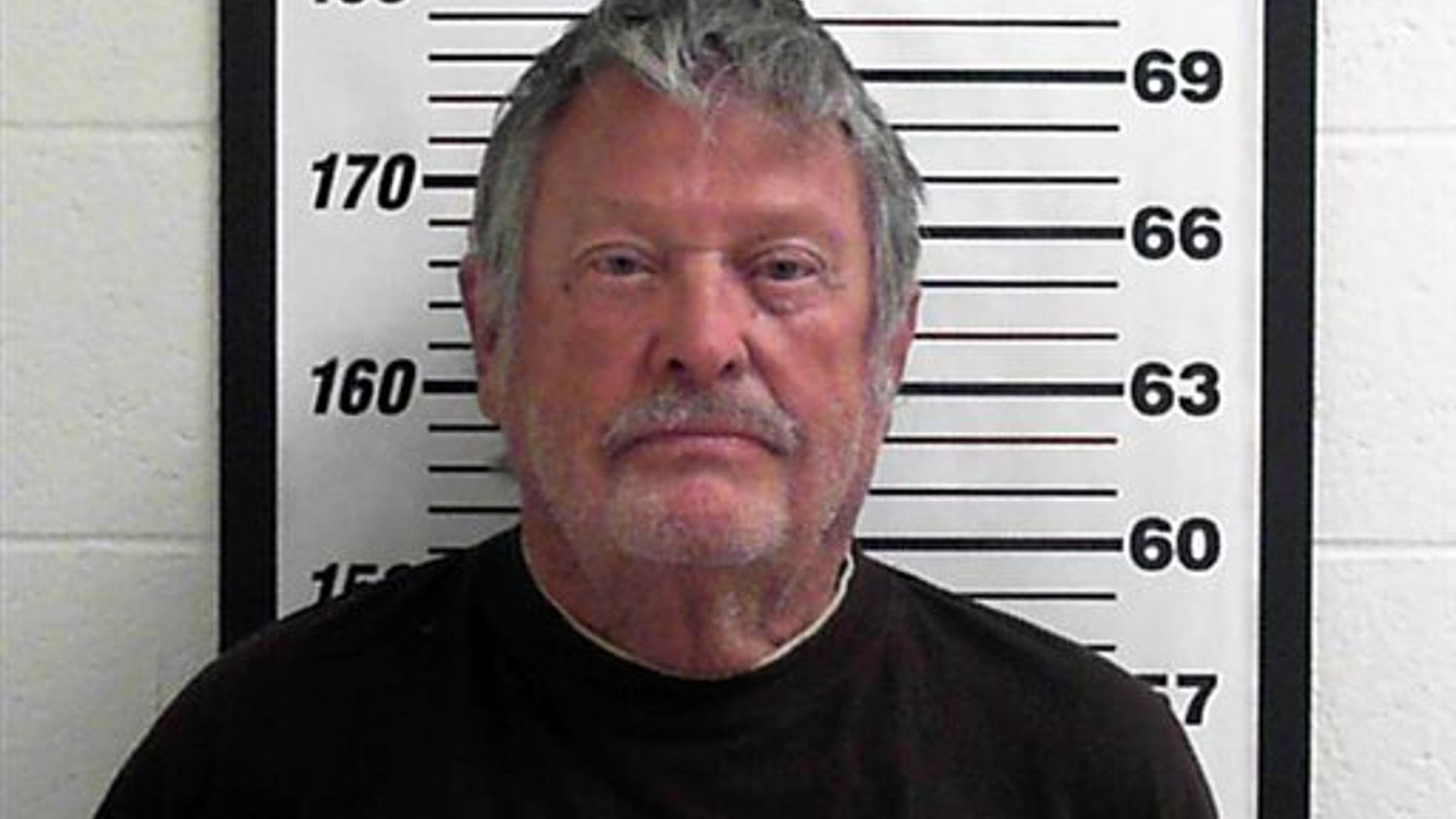 In this undated photo provided by the Davis County Jail Myron Lee Kipp poses for a booking photo, in Utah.