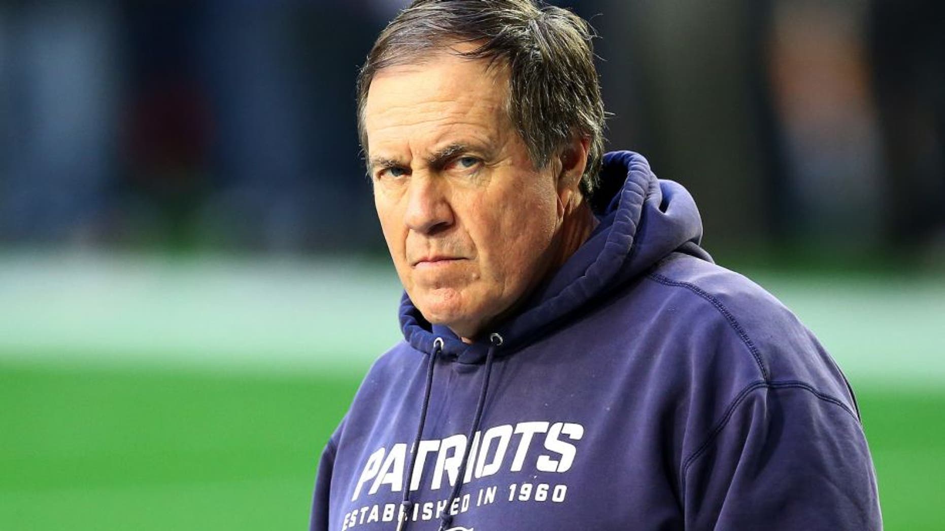 GLENDALE, AZ - FEBRUARY 01: Head coach Bill Belichick of the New England Patriots stands on the field during the pregame warm up prior to playing in Super Bowl XLIX at University of Phoenix Stadium on February 1, 2015 in Glendale, Arizona. (Photo by Ronald Martinez/Getty Images)