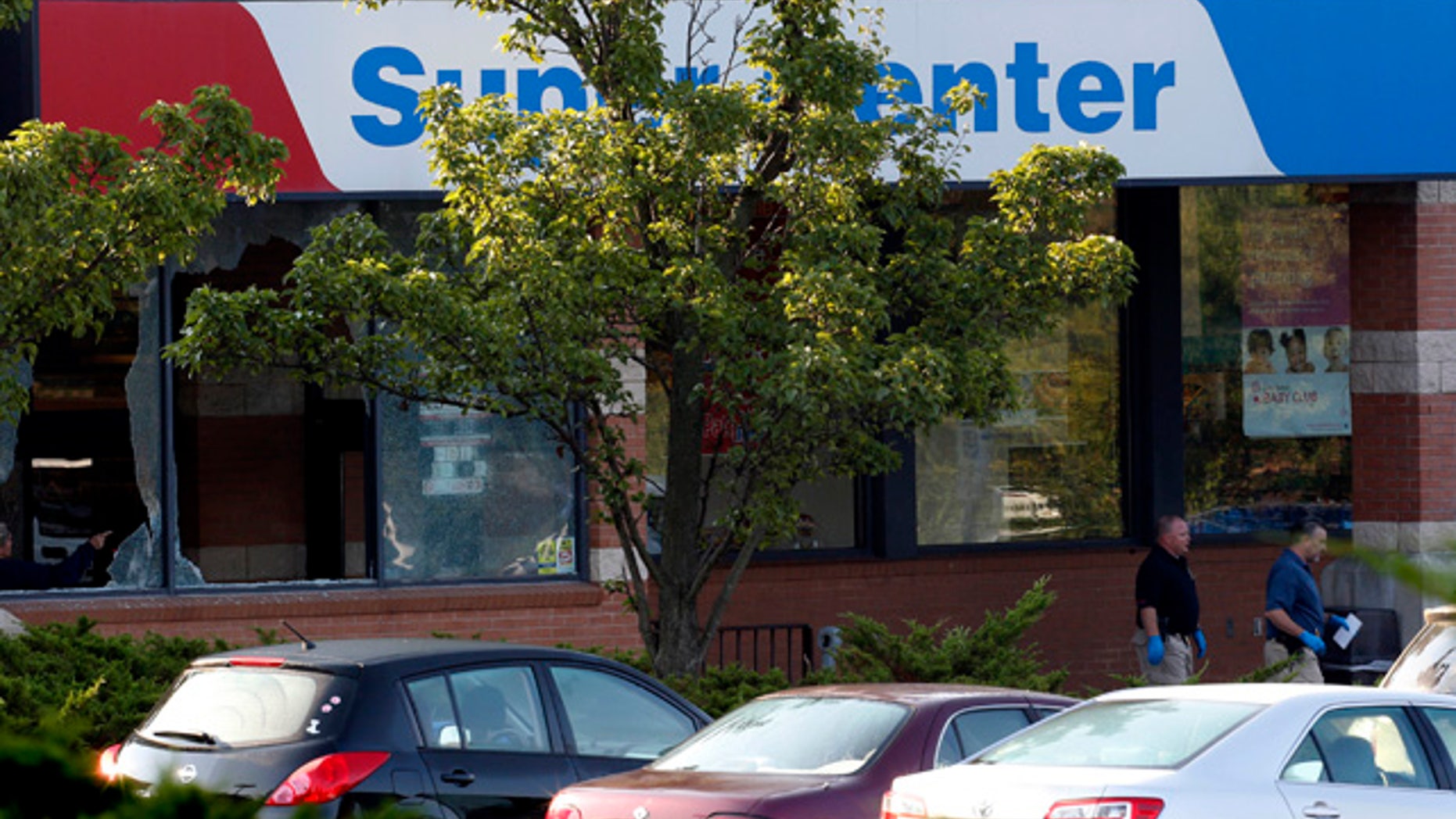 Aug. 31, 2012: Officials investigate the scene of a shooting at a Pathmark grocery store in Old Bridge, N.J. At least three people have died in the shooting. A law enforcement official briefed on the shooting says the person believed to be the shooter is among the dead. (AP)