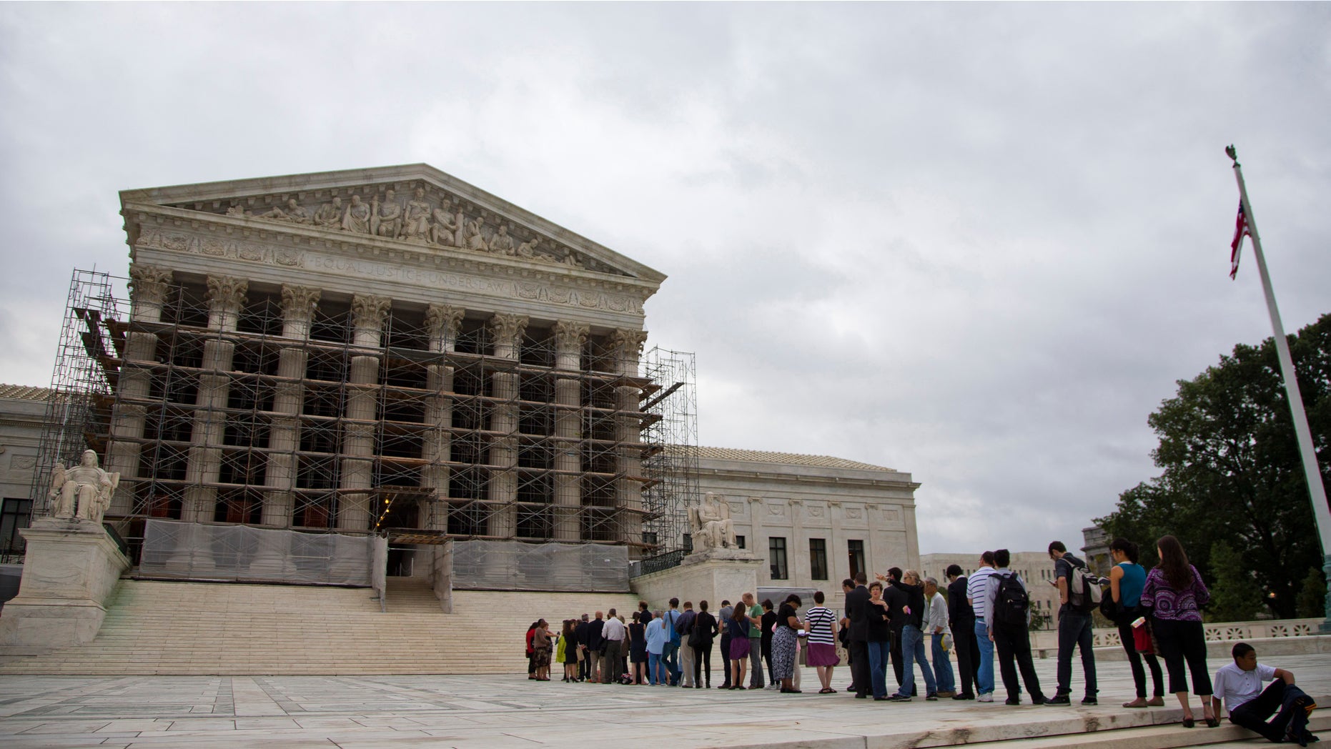 Oct. 7, 2013: People waiting in line to enter the court in Washington. The Supreme Court justices are being asked to resolve a new clash of technology and privacy in the digital age.