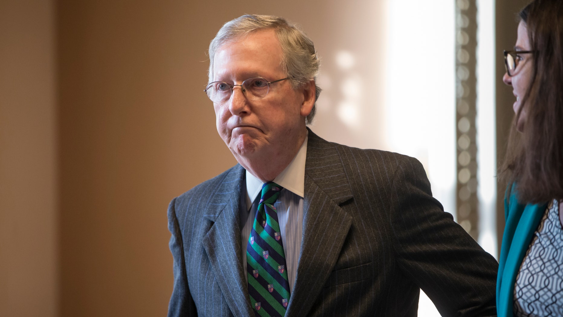 Feb. 22, 2016: Senate Majority Leader Mitch McConnell walks to his office from the chamber where he offered a tribute to the late Supreme Court Justice Antonin Scalia whose death has triggered an election-year political standoff, on Capitol Hill in Washington.