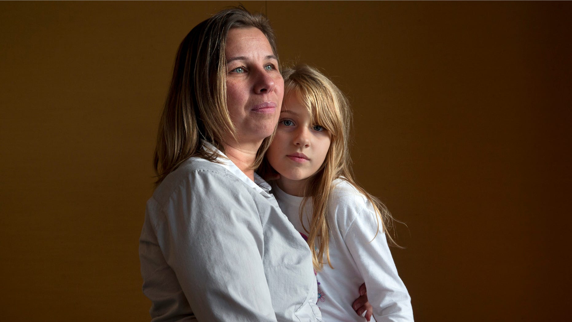 Nov. 14, 2014: Peggy Young, of Lorton, Va., with her daughter Triniti, 7, in Washington.