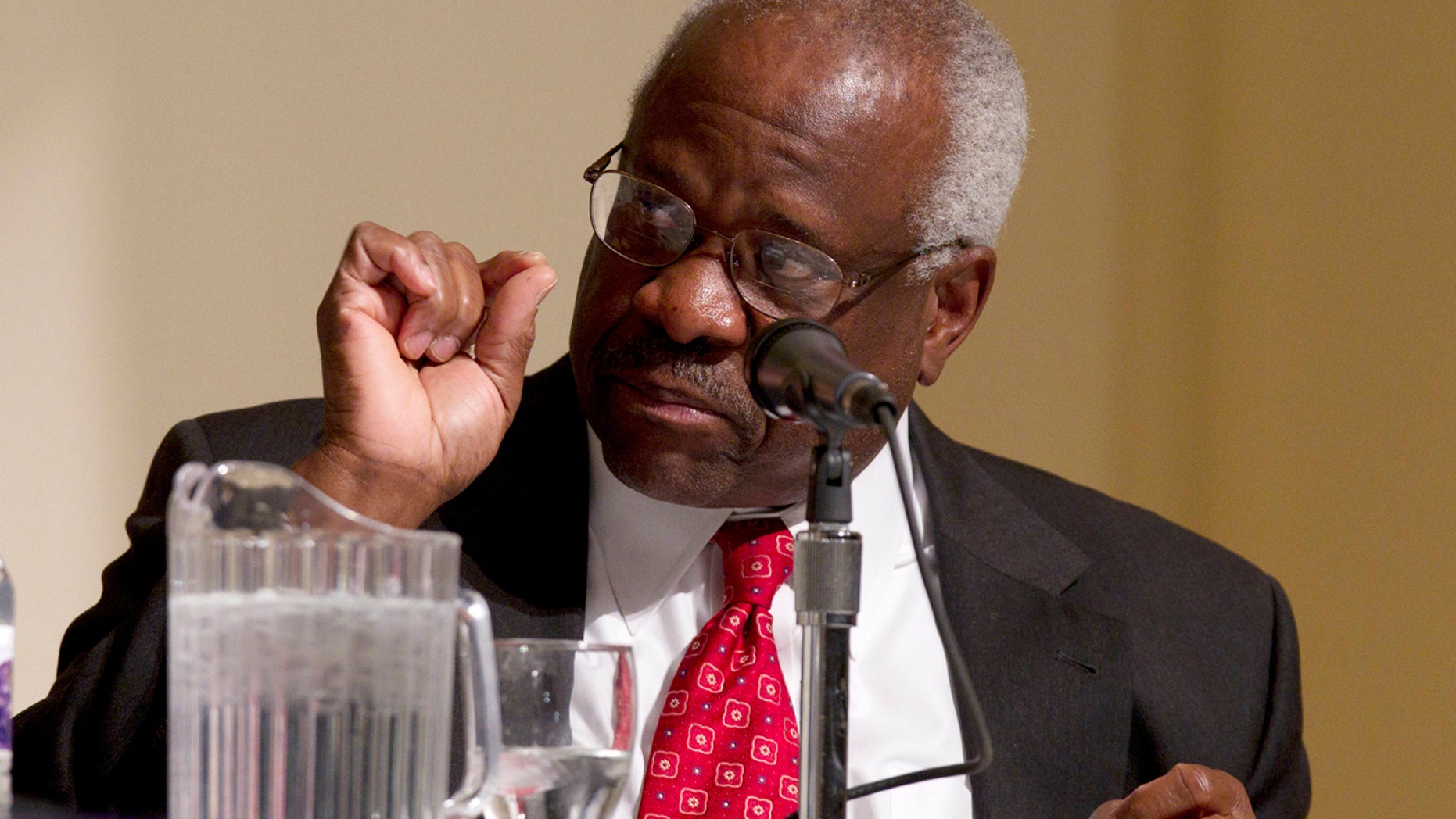 FILE - In this Jan. 26, 2012 file photo, Supreme Court Justice Clarence Thomas speaks at College of the Holy Cross in Worcester, Mass. Thomas says the Supreme Court confirmation process is an example of how the nations capital is broken in some ways. Thomas reflected Oct. 26, 2016, on his 25 years as a justice, at the Heritage Foundation, the conservative think tank where his wife once worked. (AP Photo/Michael Dwyer, File)