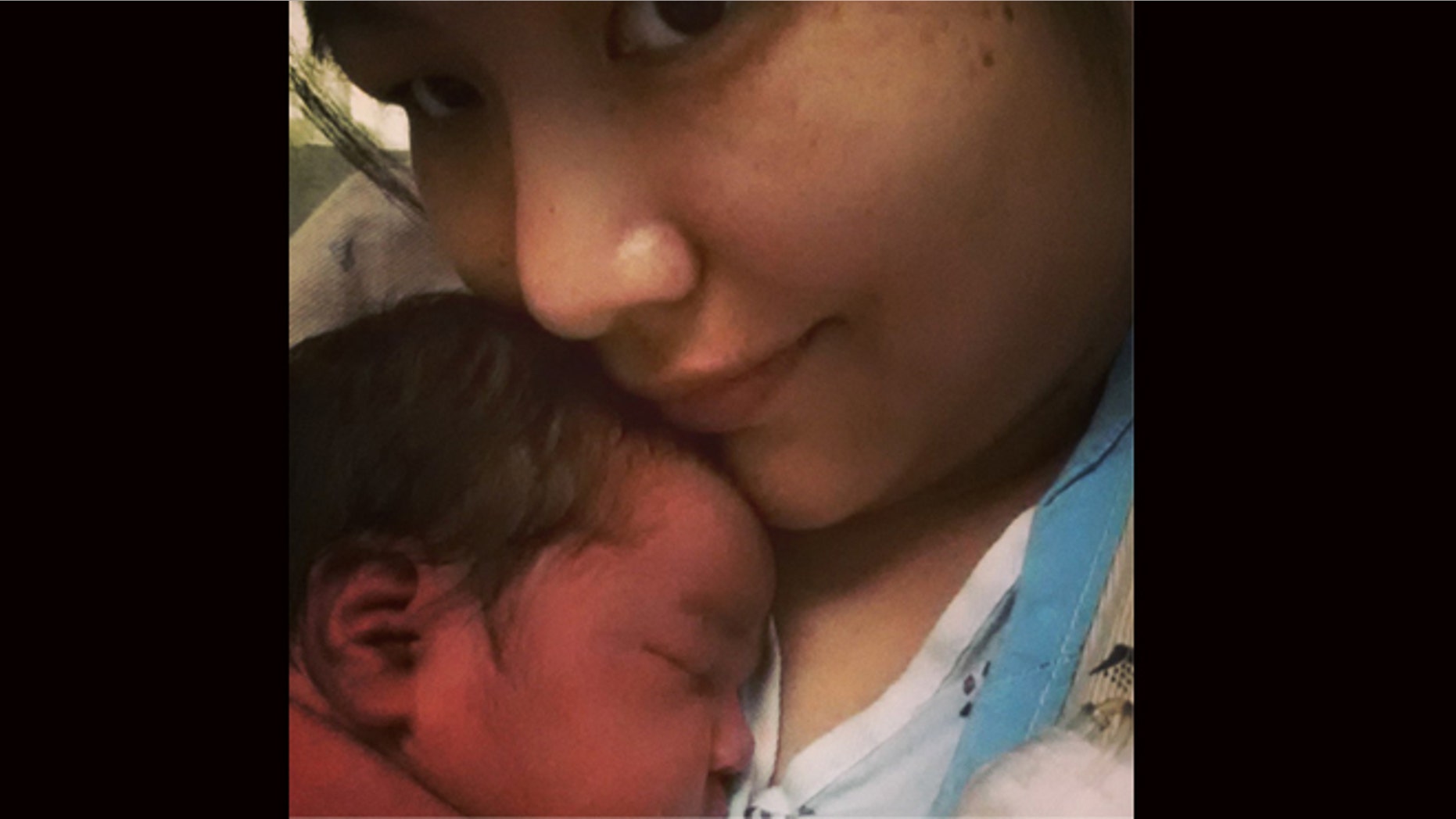 This undated cell phone picture provided by Trish Staine shows Staine, right, with her newborn baby, in Duluth, Minn. Staine, a 33-year-old aspiring half-marathon runner, says she had no idea she was pregnant before giving birth Monday, June 5, 2013. (AP Photo/Patricia Staine)