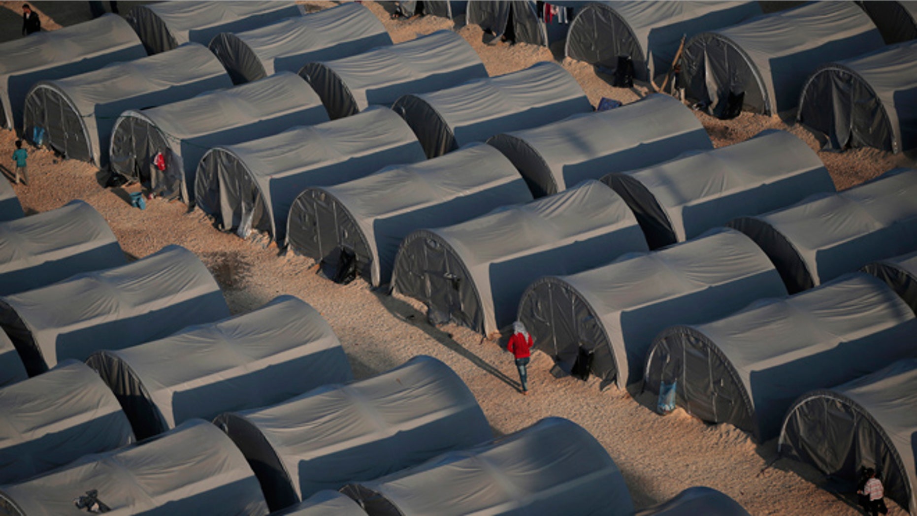 In this Oct, 17, 2014, file photo, Syrian Kurdish refugees are seen at a refugee camp in Suruc, on the Turkey-Syria border.