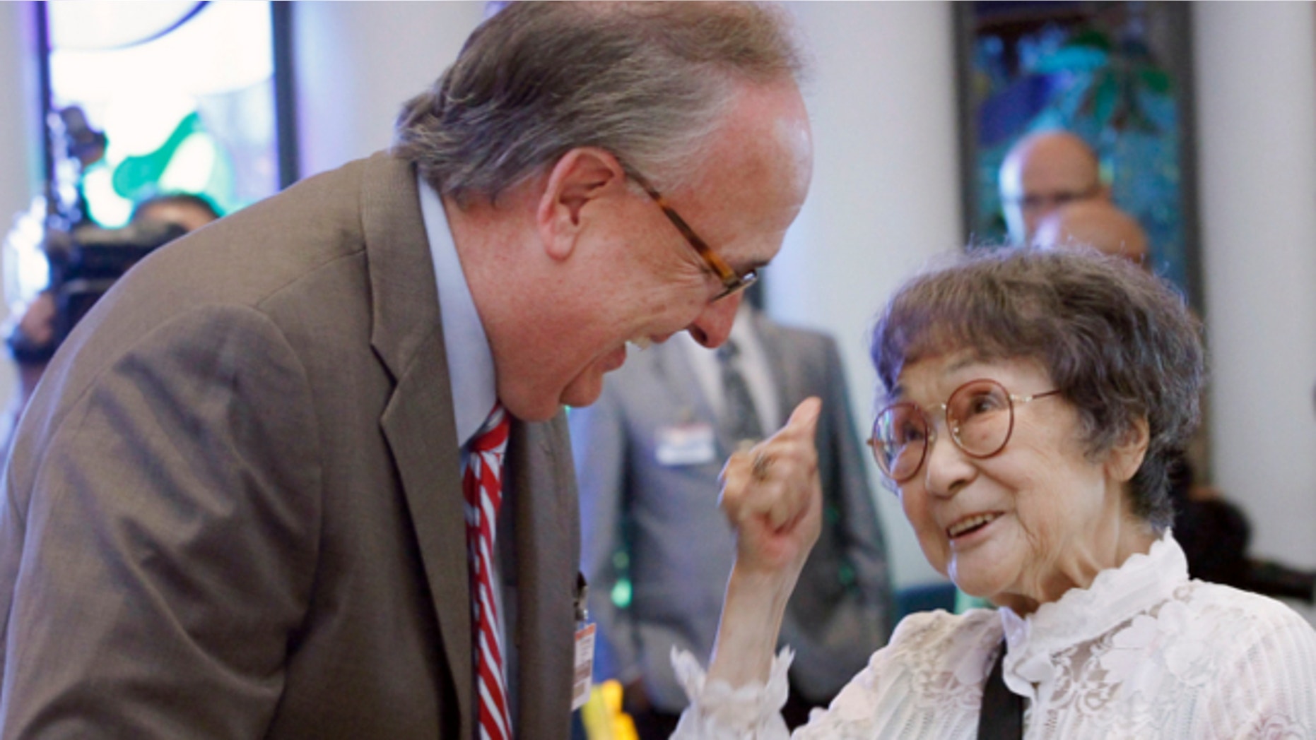 June 28, 2013: Survivor of atomic blast in Hiroshima, Kaz Sueishi, right, President of the American Society of Hiroshima-Nagasaki A-bomb Survivors, is greeted by Michael Hunn, Senior Vice President/ Chief Executive of Providence Health & Services, during a press conference in Torrance, Calif.
