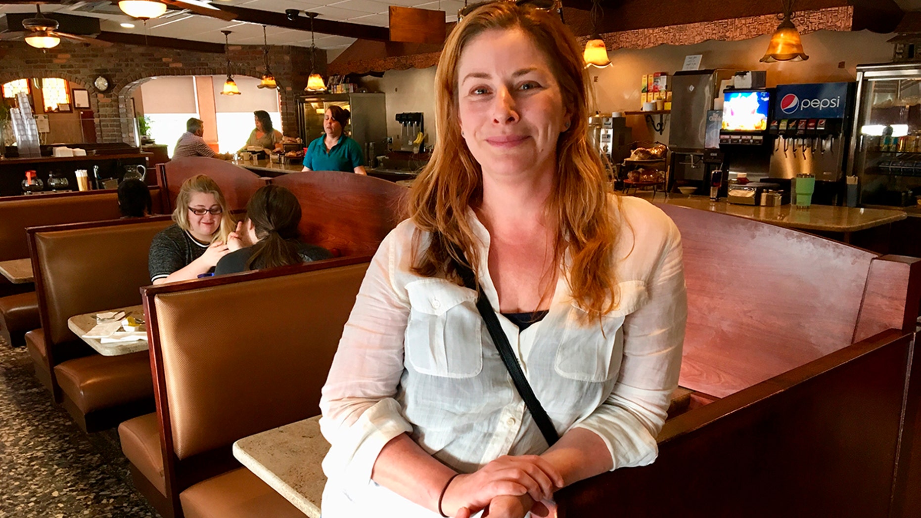 Diane Neal poses at a diner Wednesday, May 2, 2018, during an interview in Kingston, N.Y., discussing her campaign for the 19th congressional district. The former "Law and Order" actress is seeking a new gig as representative of a sprawling congressional district in upstate New York.(AP Photo/Mary Esch)