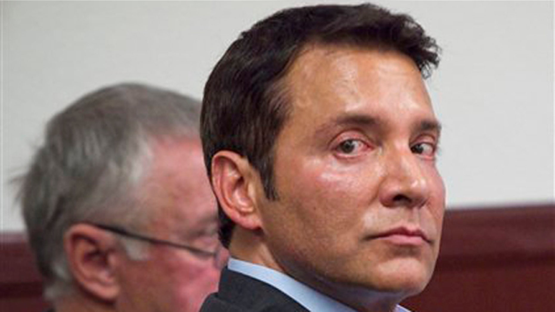 In this Nov. 8, 2011 file pool photo, self-help author James Arthur Ray sits with one of his attorneys, Thomas Kelly, during a pre-sentencing hearing at Yavapai County Courthouse in Prescott, Ariz.