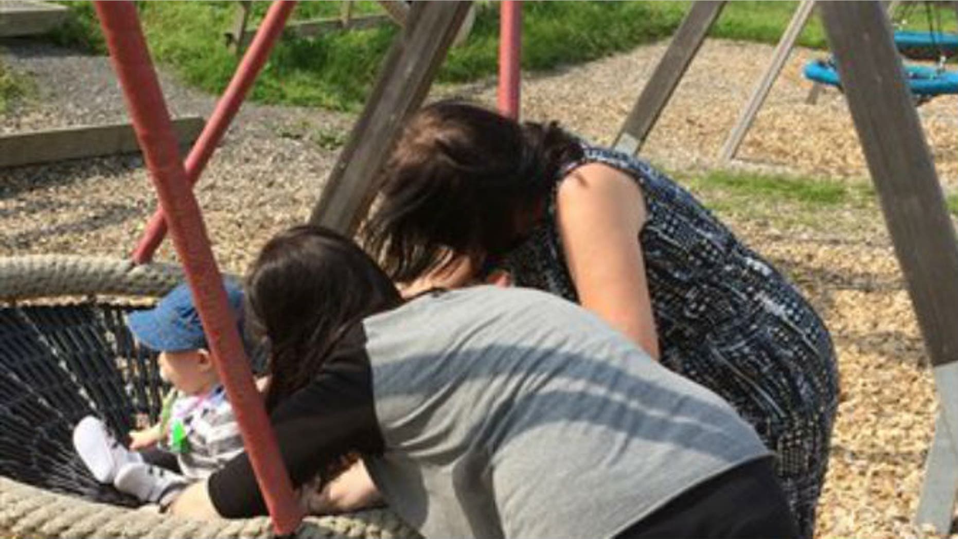 A young Swedish mother, foreground, with her child and and her mother play with the child on a swing in Gothenburg Sweden Sunday Aug. 16, 2015. For this family in Sweden, a pioneering procedure has led to a baby being born from the same womb that nurtured his mother, uniting three generations. The new mother, who lost her own uterus to cancer in her 20s, said it was “unimaginable” that she now had her own child, thanks to her mother’s donated womb.(AP Photo/Maria Cheng)