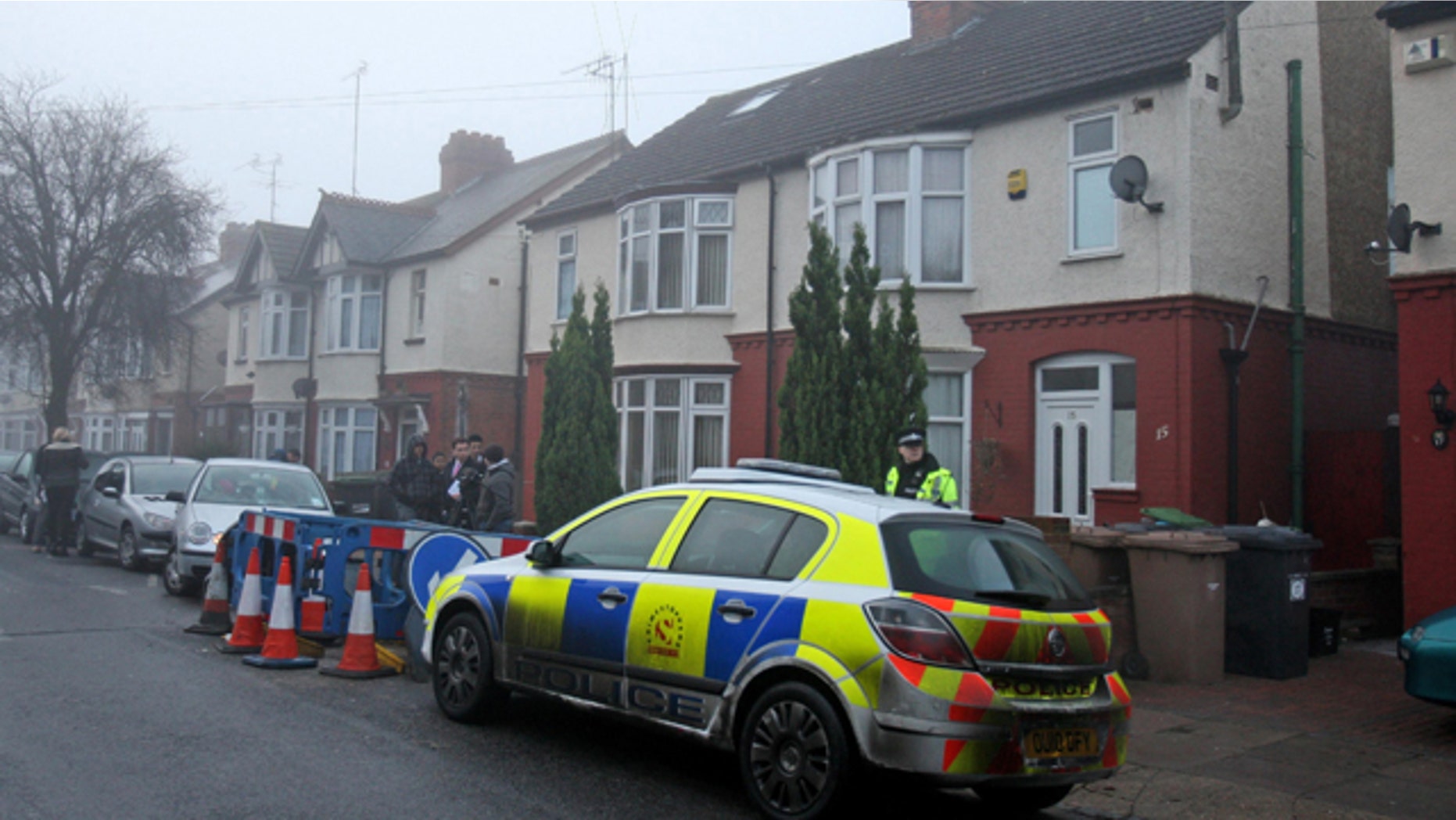 Dec. 13: A British police officer stands outside a property after it was searched in Luton, England. Two people were wounded in central Stockholm on Saturday in what appeared to be the first suicide bombing in the history of Sweden, which has been spared the major terrorist strikes seen in several other European countries. The alleged bomber lived in Luton and studied at the University of Bedfordshire. No arrests had been made and no hazardous materials were found at the property, authorities said. (AP)