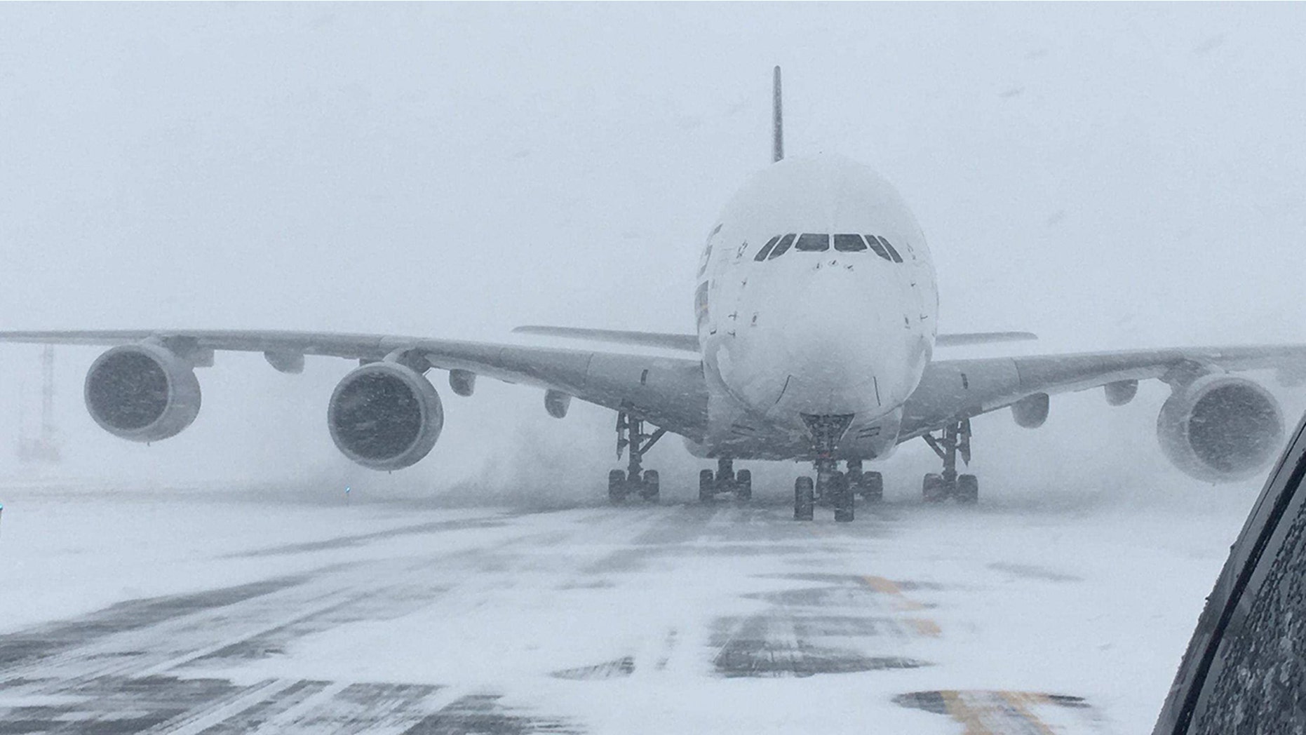 The world's largest passenger plane, a Singapore Airlines Airbus A380, was forced to land at Stewart International Airport on Thursday due to blizzard conditions.