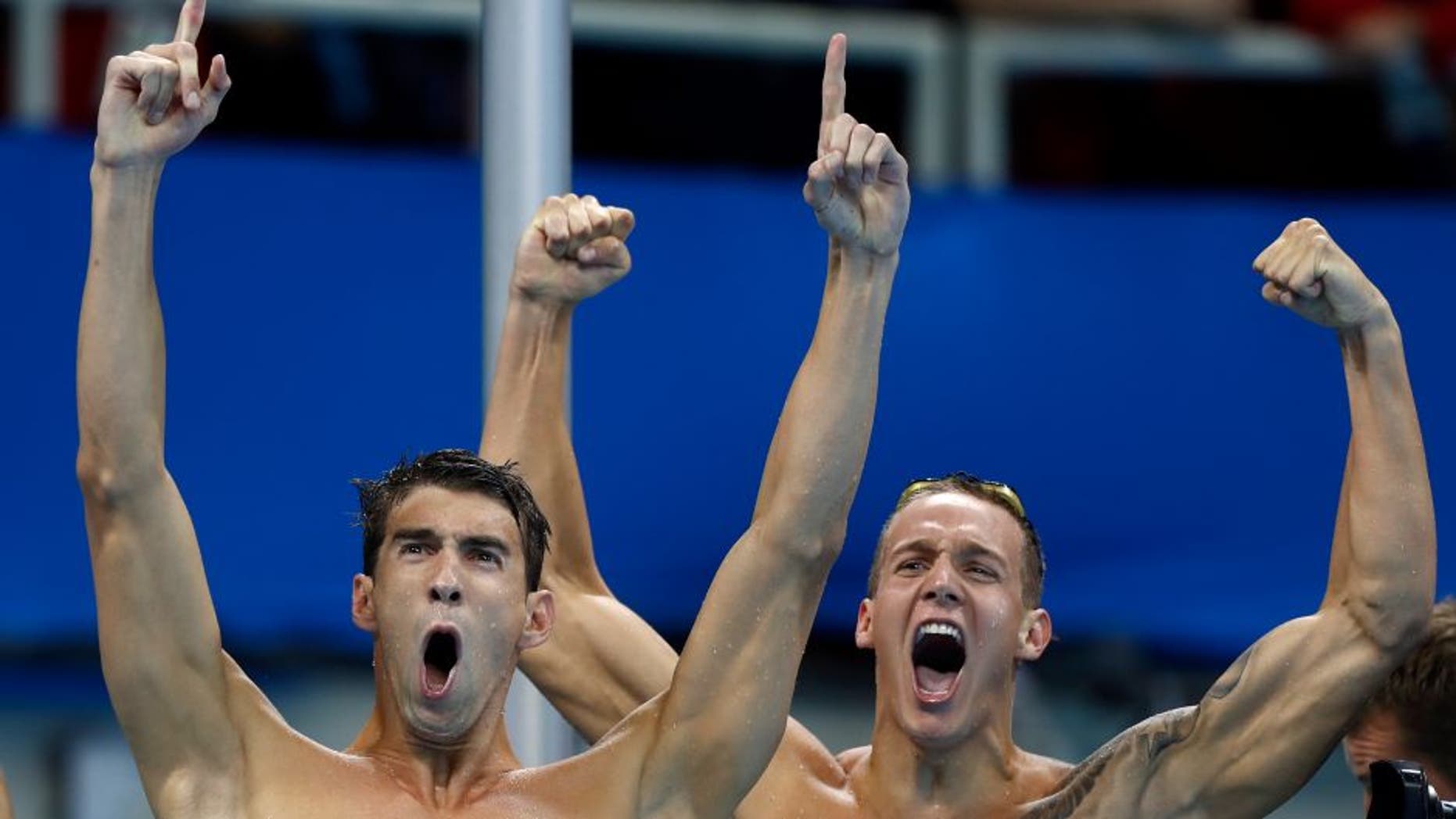 RIO DE JANEIRO, BRAZIL - AUGUST 07: Michael Phelps and Caeleb Dressel of the United States celebrate winning gold in the Final of the Men's 4 x 100m Freestyle Relay on Day 2 of the Rio 2016 Olympic Games at the Olympic Aquatics Stadium on August 7, 2016 in Rio de Janeiro, Brazil. (Photo by Clive Rose/Getty Images)