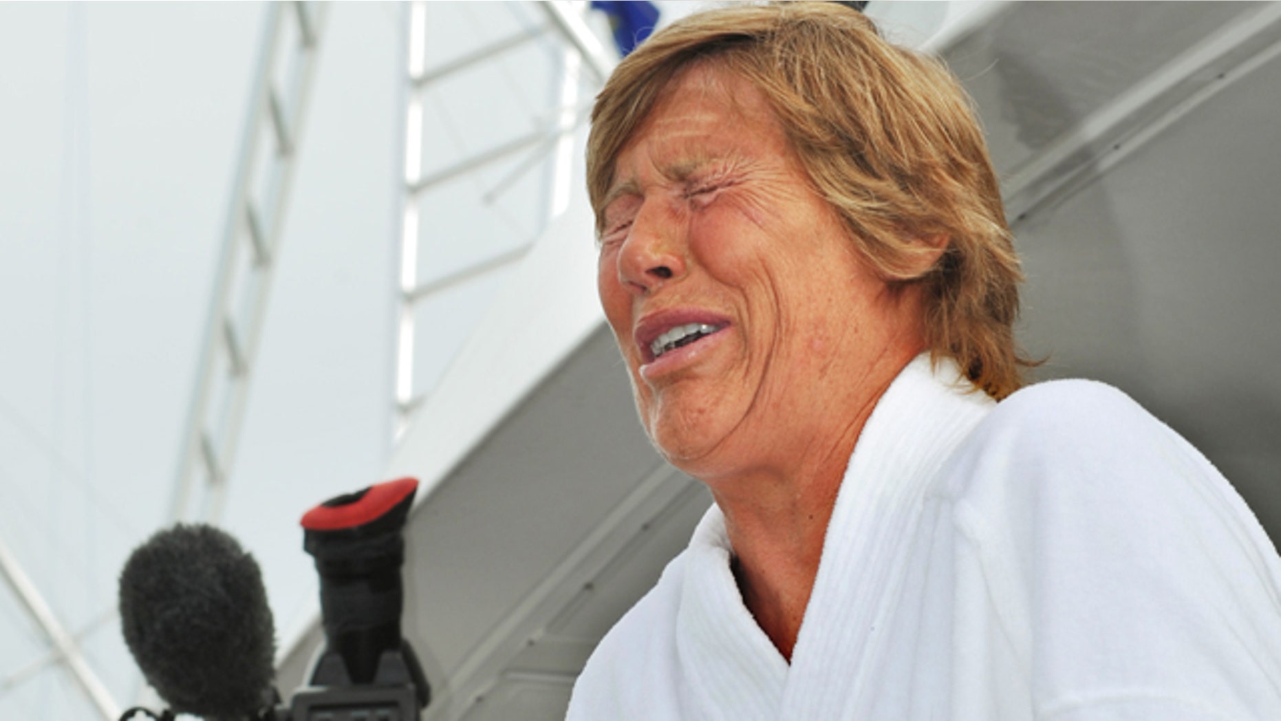 Aug. 9: Diana Nyad cries as she speaks to reporters and fans after arriving back in Key West.