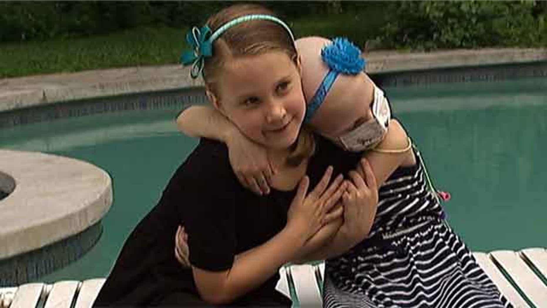 Hayden, left, was found to be a perfect match to donate bone marrow to her sister Sydney, right.