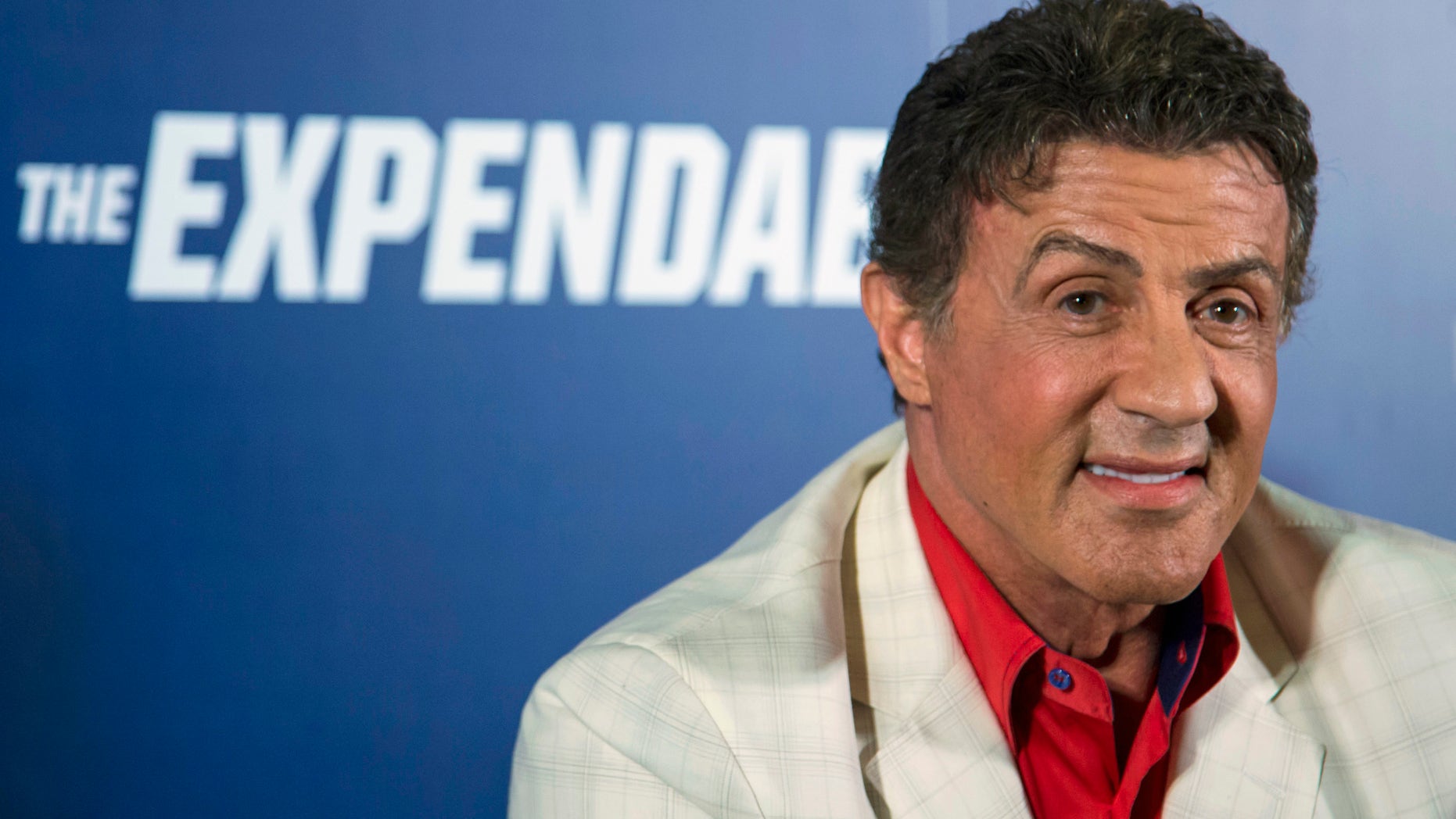 August 22, 2014. Cast member Sylvester Stallone arrives on the red carpet for the special screening of "The Expendables 3" in Macau.