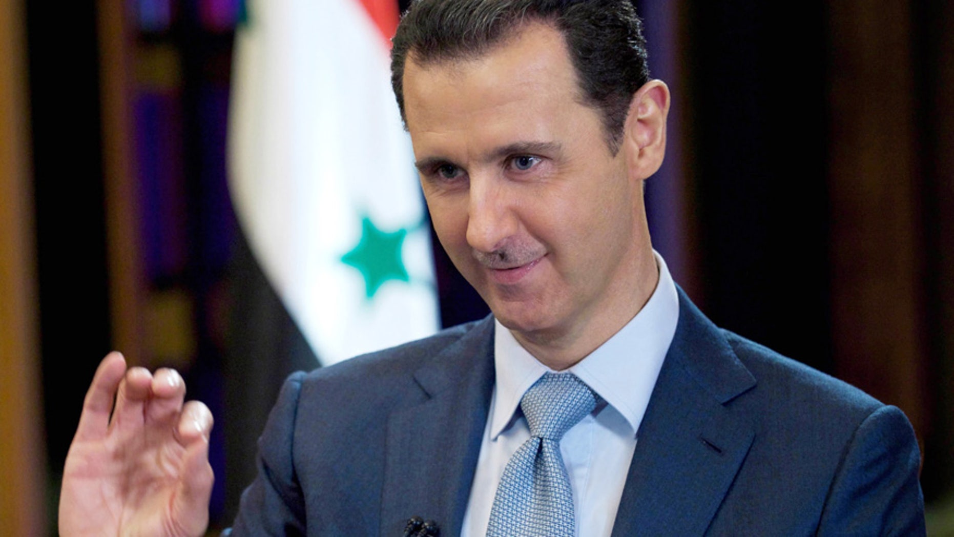 In this Feb. 10, 2015, file photo released by the Syrian official news agency SANA, Syrian President Bashar Assad gives an interview with the BBC in Damascus, Syria