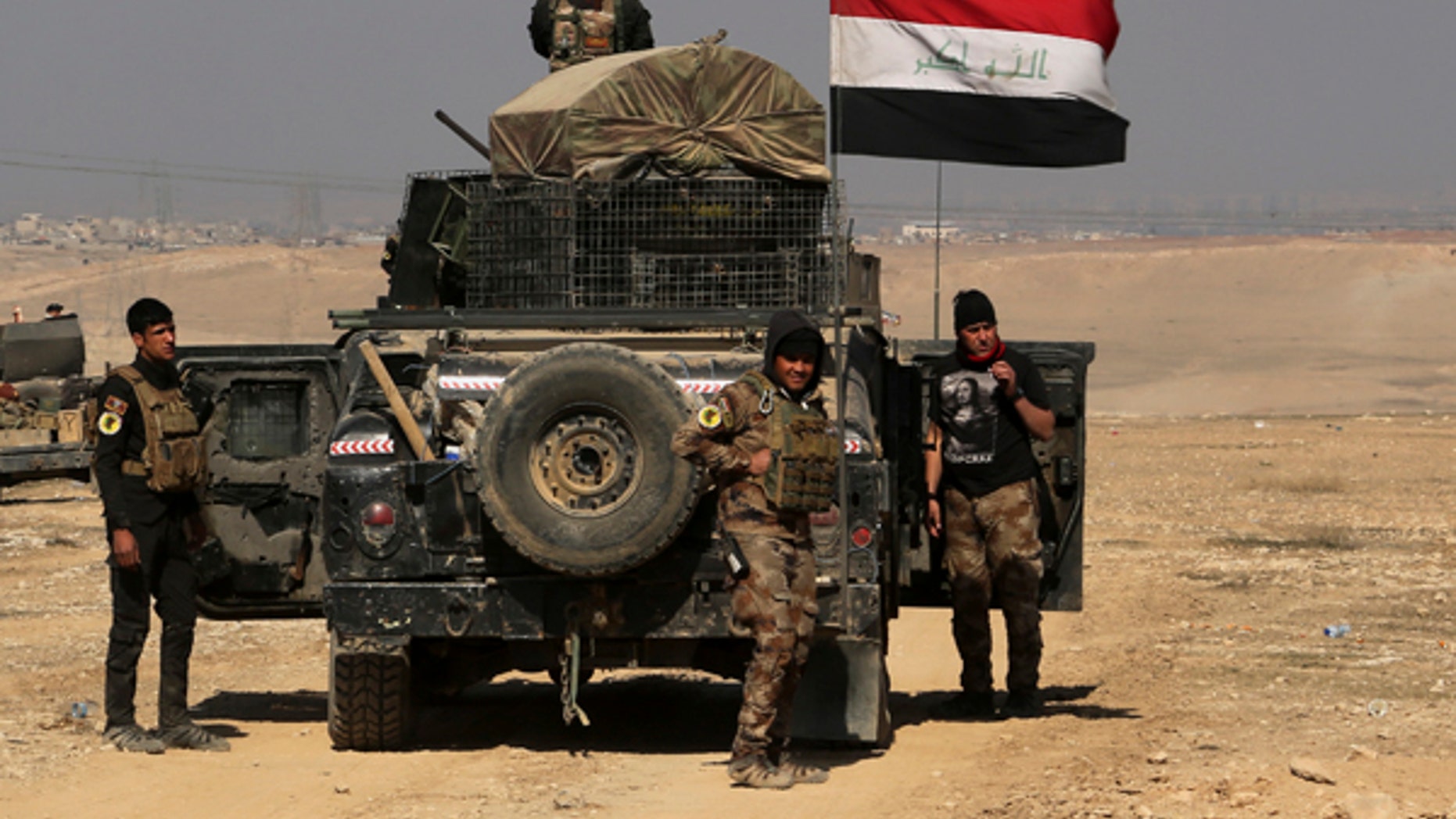 Iraqi special forces advance towards the western side of Mosul, Iraq, Thursday, Feb. 23, 2017. The advance comes as part of a major assault that started five days earlier to drive Islamic State militants from the western half of Mosul, Iraq's second-largest city. (AP Photo/ Khalid Mohammed)