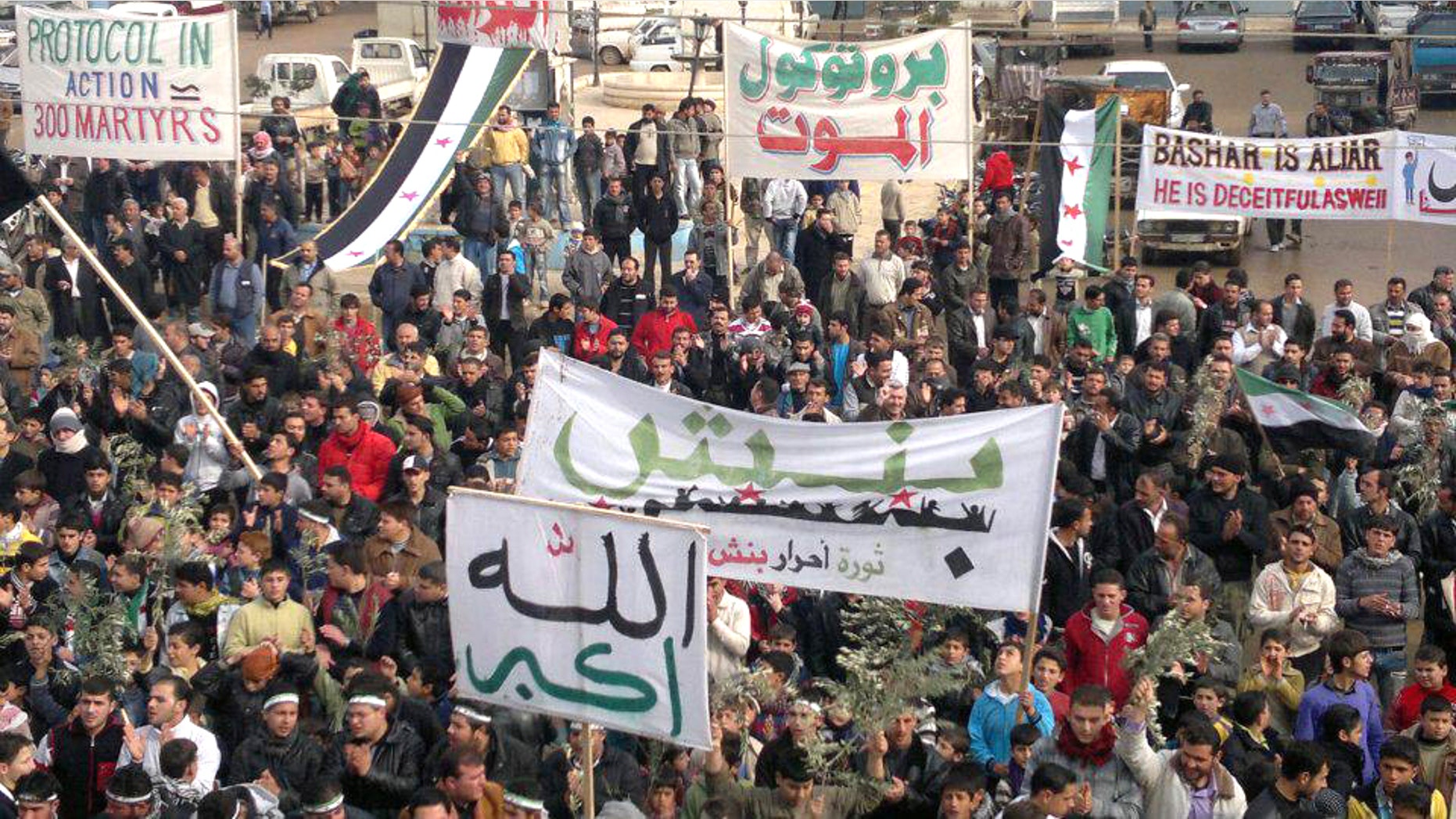 Dec. 23: Demonstrators protest against Syria's President Bashar al-Assad after Friday prayers in Binsh near Adlb