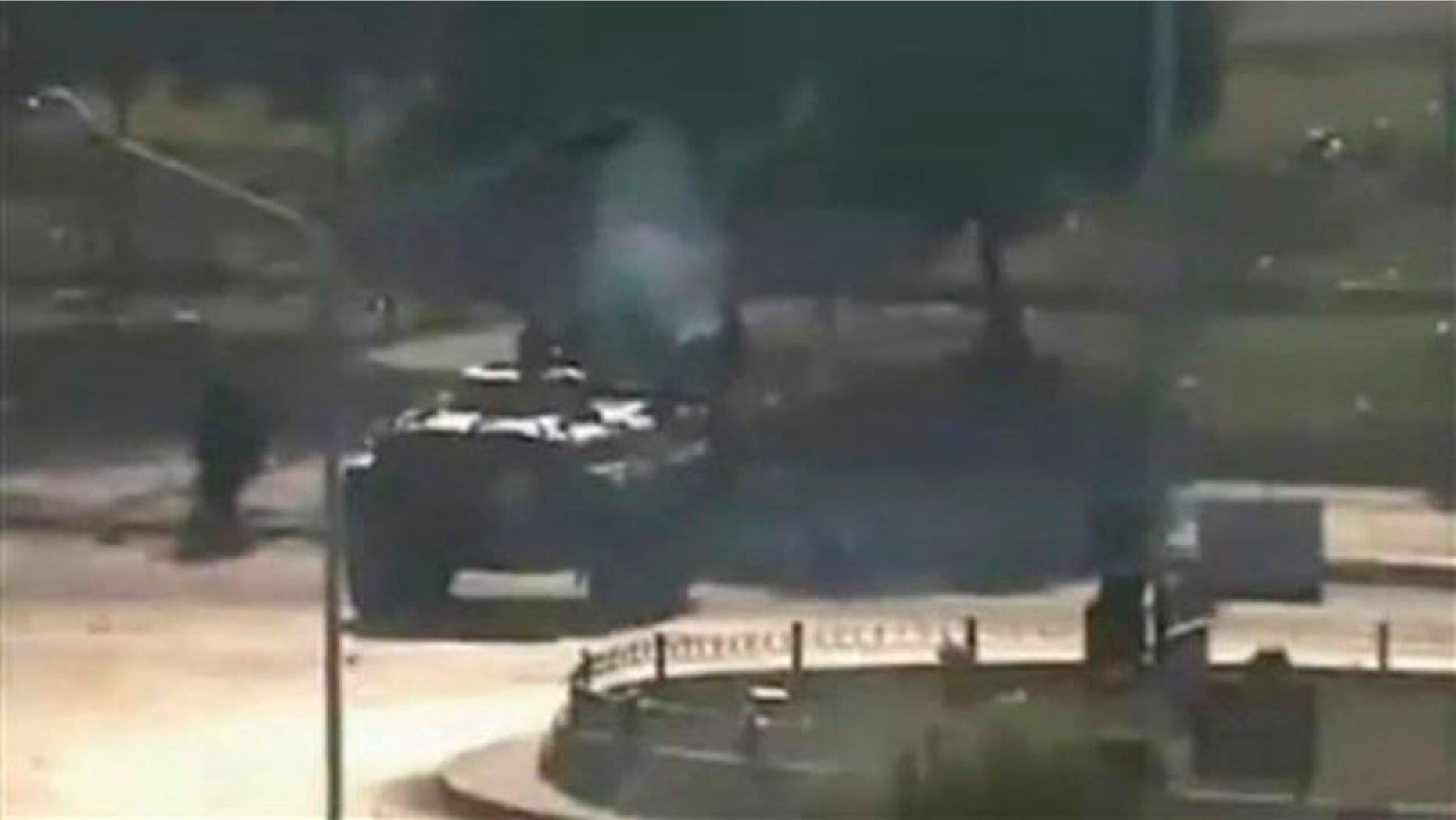 This Aug. 3 file image posted on the Internet by Shaam News Network shows what they purport to be a military tank on the streets of the city of Hama, Syria.