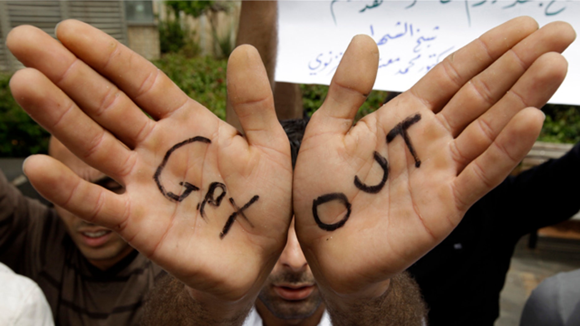 May 2: A Syrian Kurdish protester shows his palms as he shouts anti-Syrian President Bashar Assad slogans during a sit-in in front of the U.N. house in downtown Beirut, Lebanon. (AP)