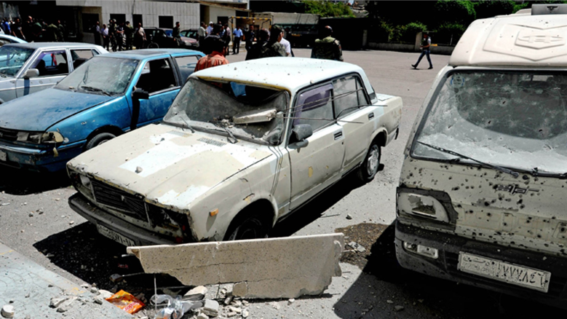 April 29, 2014: In this photo which AP obtained from the Syrian official news agency SANA, and has been authenticated based on its contents and other AP reporting, damages are seen after a series of mortar shells hit Damascus, killing more than a dozen people and wounding scores in Syria.
