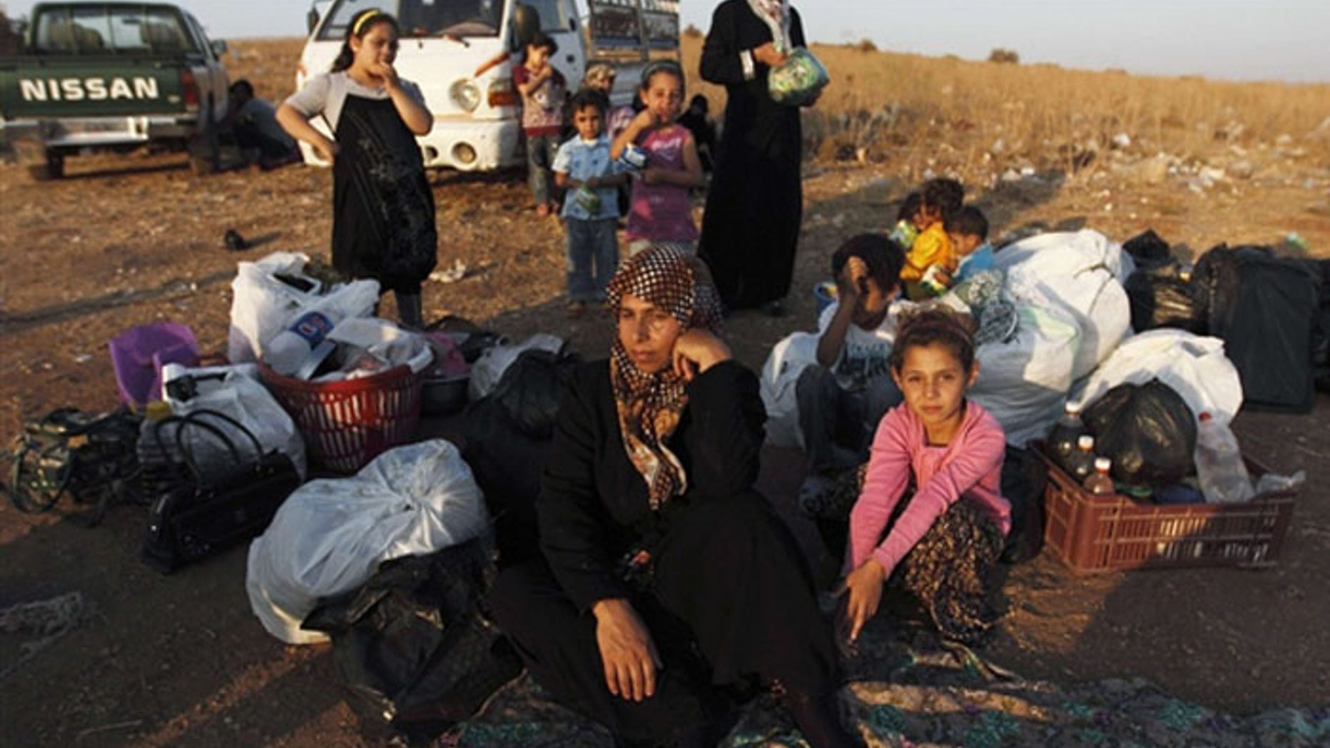 A wave of Syrian refugees, many of them Palestinian, is sparking a regional humanitarian crisis - but Hamas and the Palestinian Authority aren't helping. (AP)