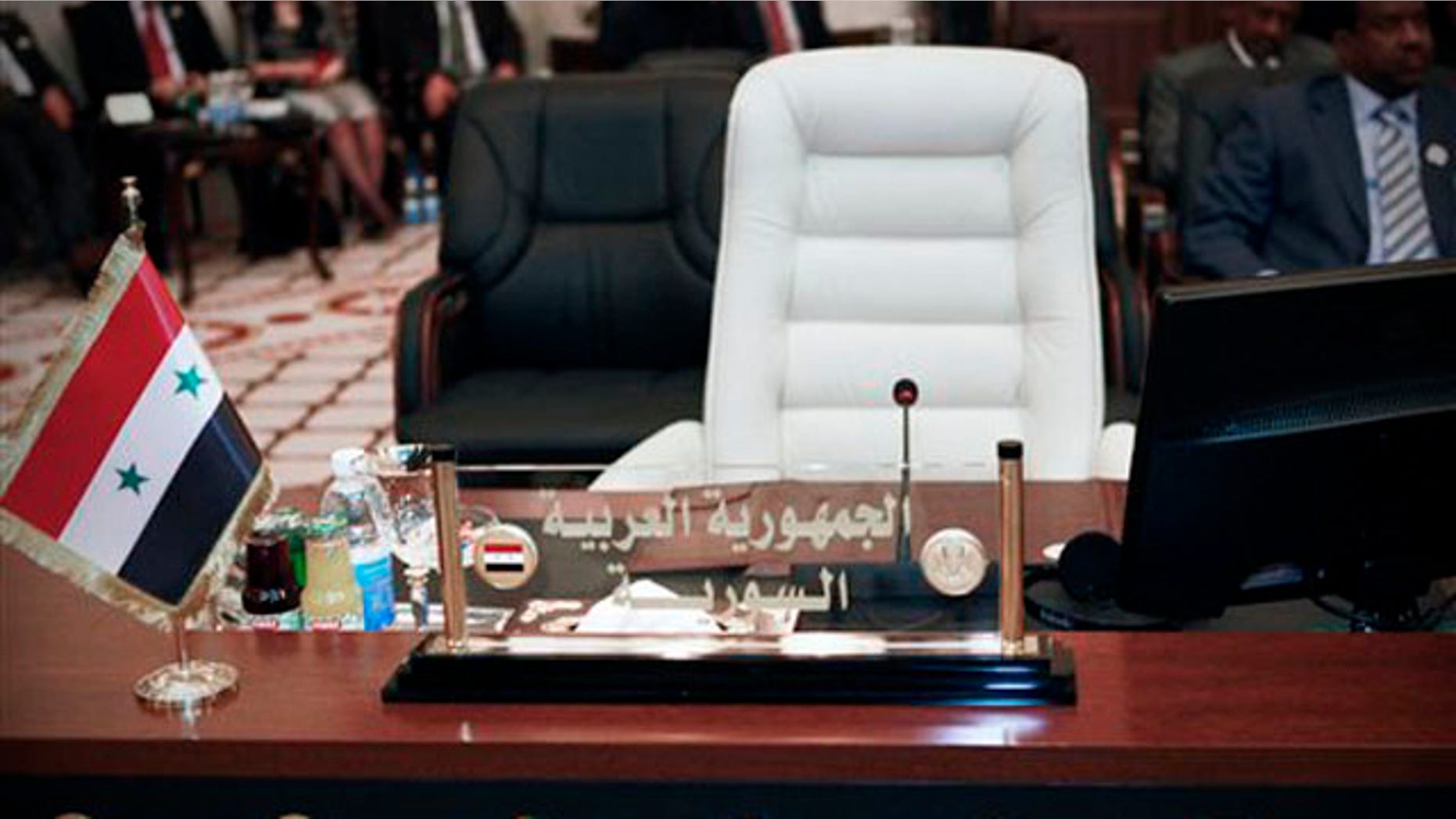 March 28,2012: The empty seat of the Syrian Foreign Minister is seen during the meeting of Arab Foreign Ministers in Baghdad, Iraq.