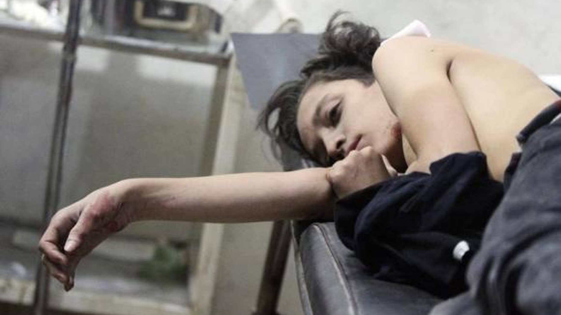 Oct. 20, 2014: An injured boy lies at a field hospital after what activists said were air strikes by forces of Syria's President Bashar al-Assad in the Duma neighborhood of Damascus.