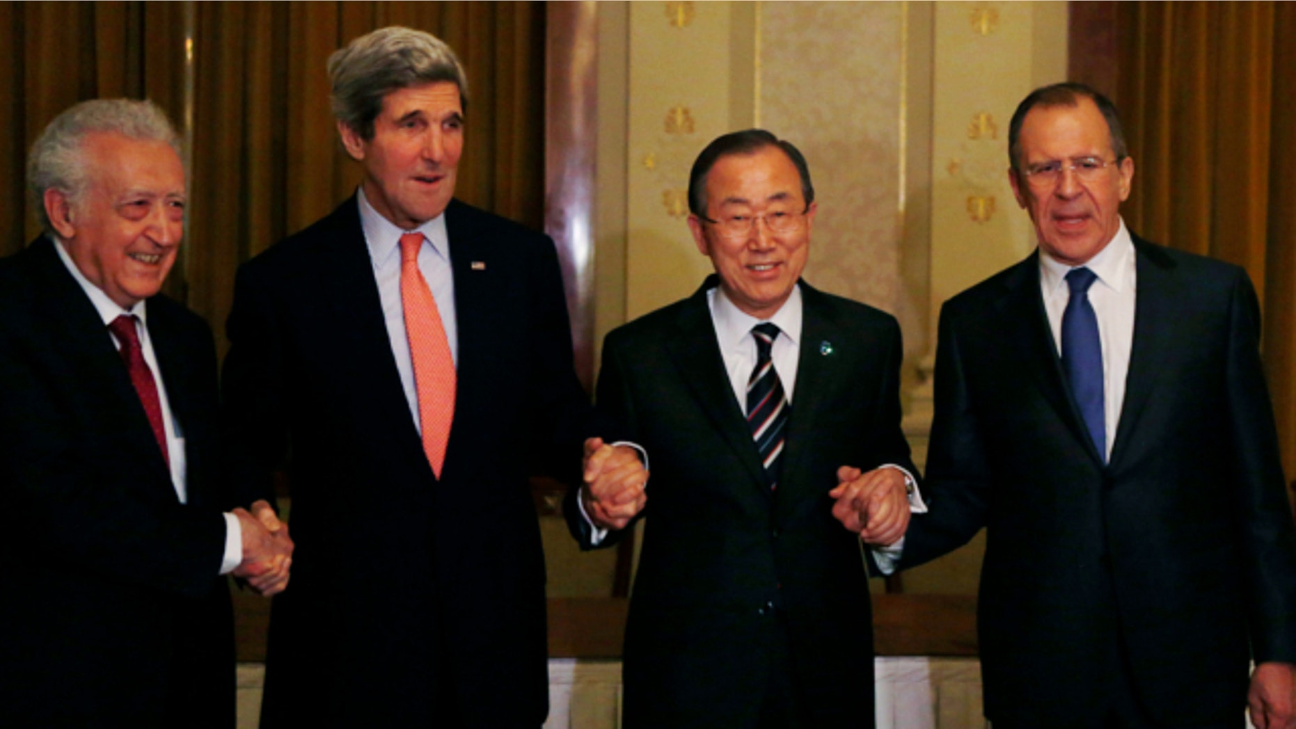 From left: UN-Arab League Envoy to Syria Lakhdar Brahimi, United Jan. 21, 2014: States Secretary of State John Kerry, UN Secretary-General Ban Ki-moon and Russia's Foreign Minister Sergey Lavrov join hands after their international conference on ending the crisis in Syria in Montreux, Switzerland.