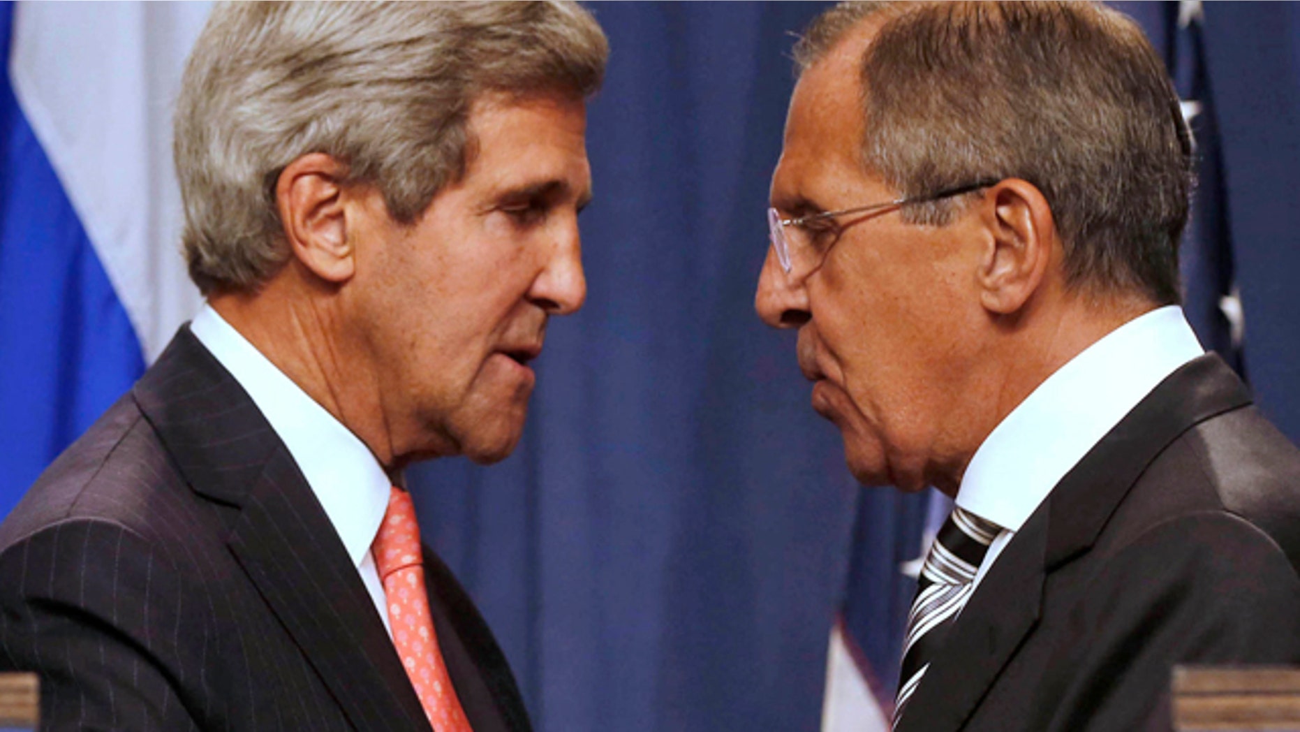 Sept. 14, 2013: U.S. Secretary of State John Kerry, left, and Russian Foreign Minister Sergei Lavrov, shake hands after making statements to the media following meetings regarding Syria, at a news conference in Geneva, Switzerland.
