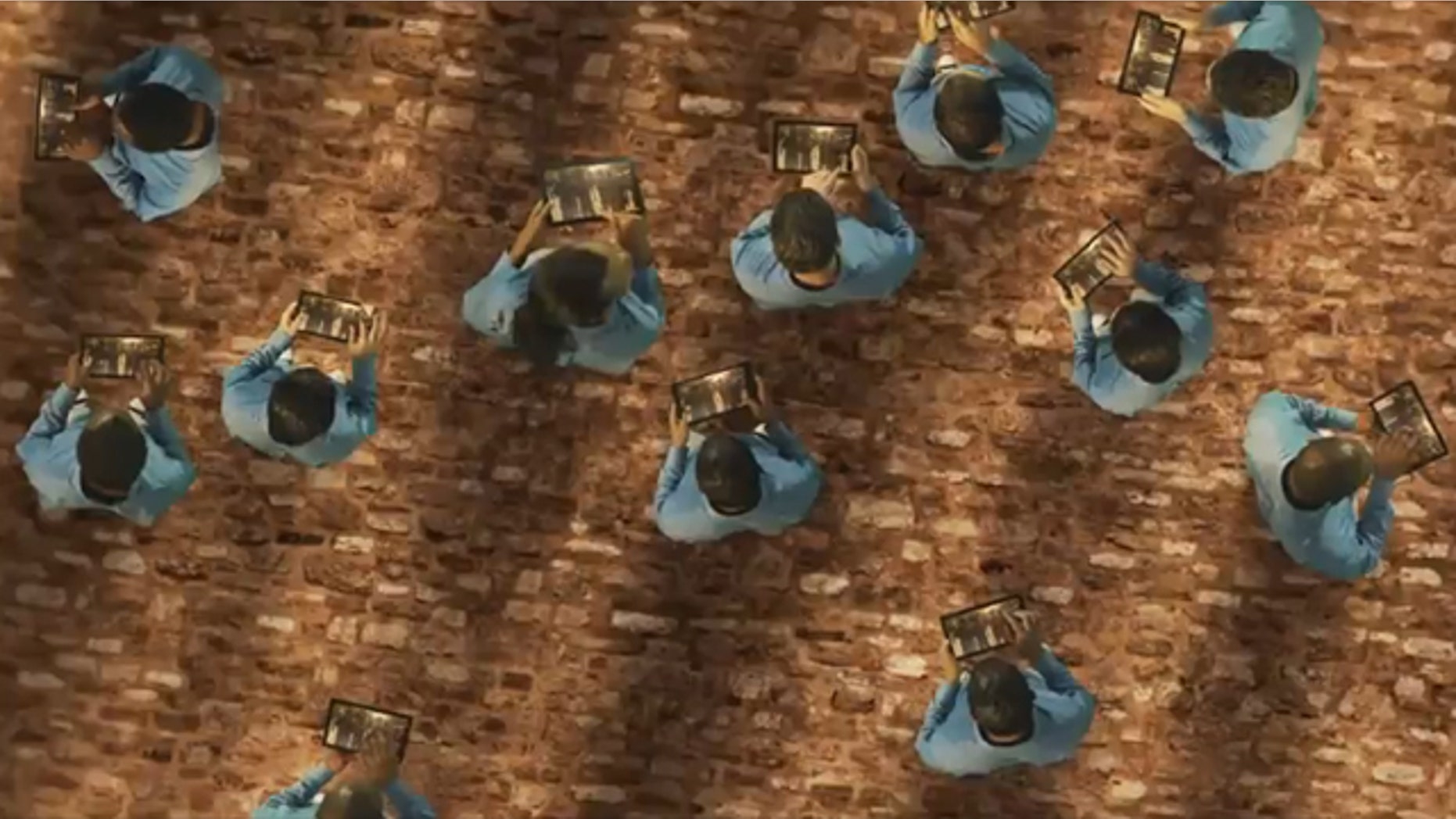 TabCo's new ad depicts current tablet buyers as lemmings falling off a cliff.