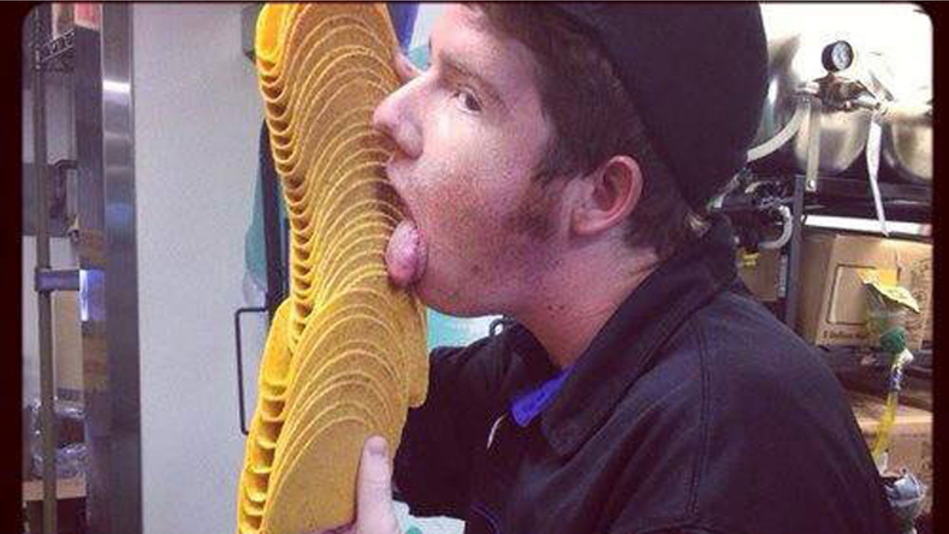 The Irvine-based company said the photograph, above, was taken for a contest showing employees enjoying their first bite of the product. It wasn't submitted, but a worker posted it to a Facebook page, which violates company policy.