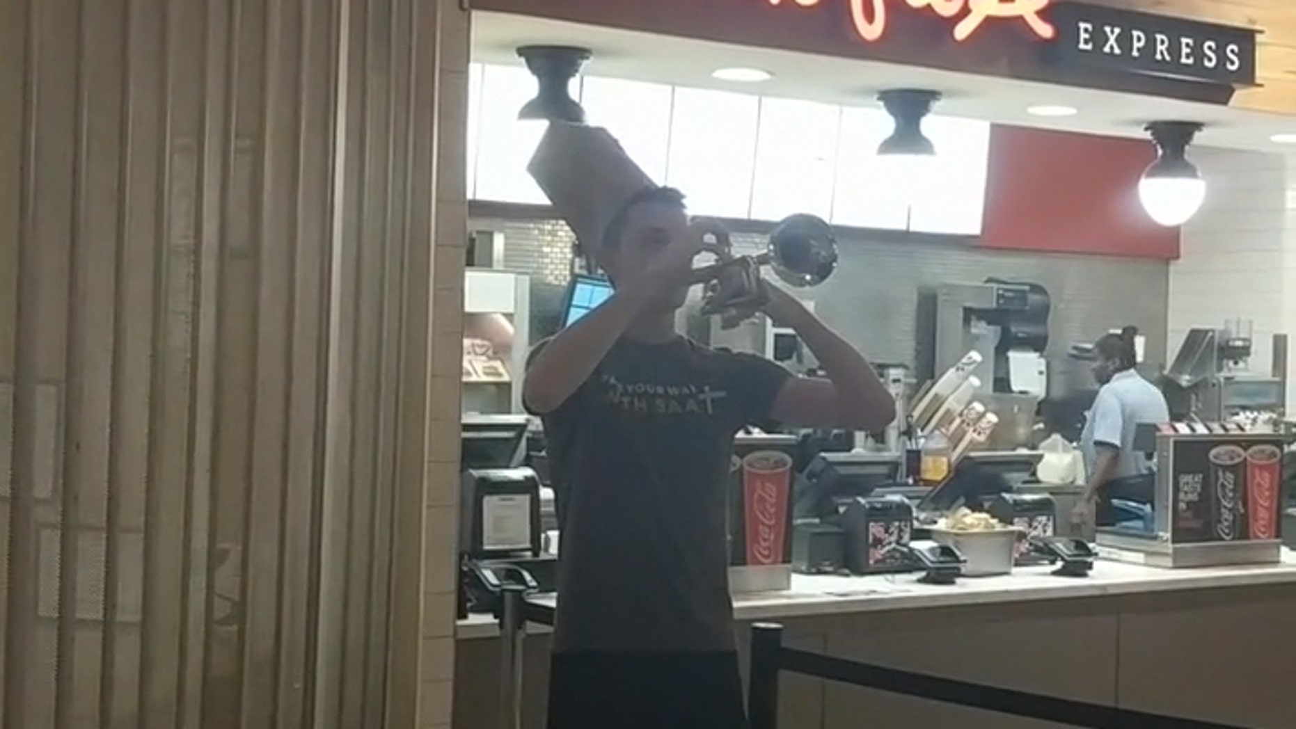 A young man played a rendition of taps in honor of the Taco Bell that closed on Georgia Tech's campus last week.