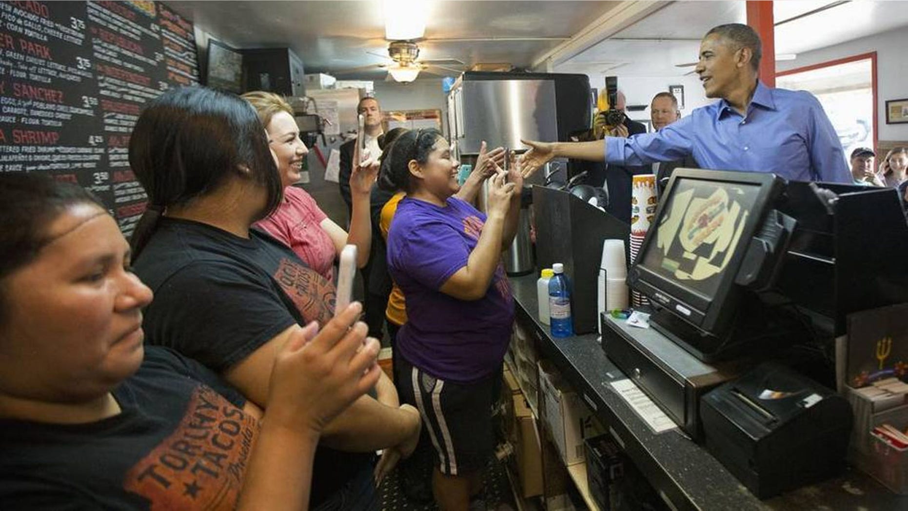 President Barack Obama greets employees during an unannounced stop at Torchy’s Tacos in Austin on Friday. There are several Torchy’s in North Texas. Obama traveled to Austin, to speak at SXSW.