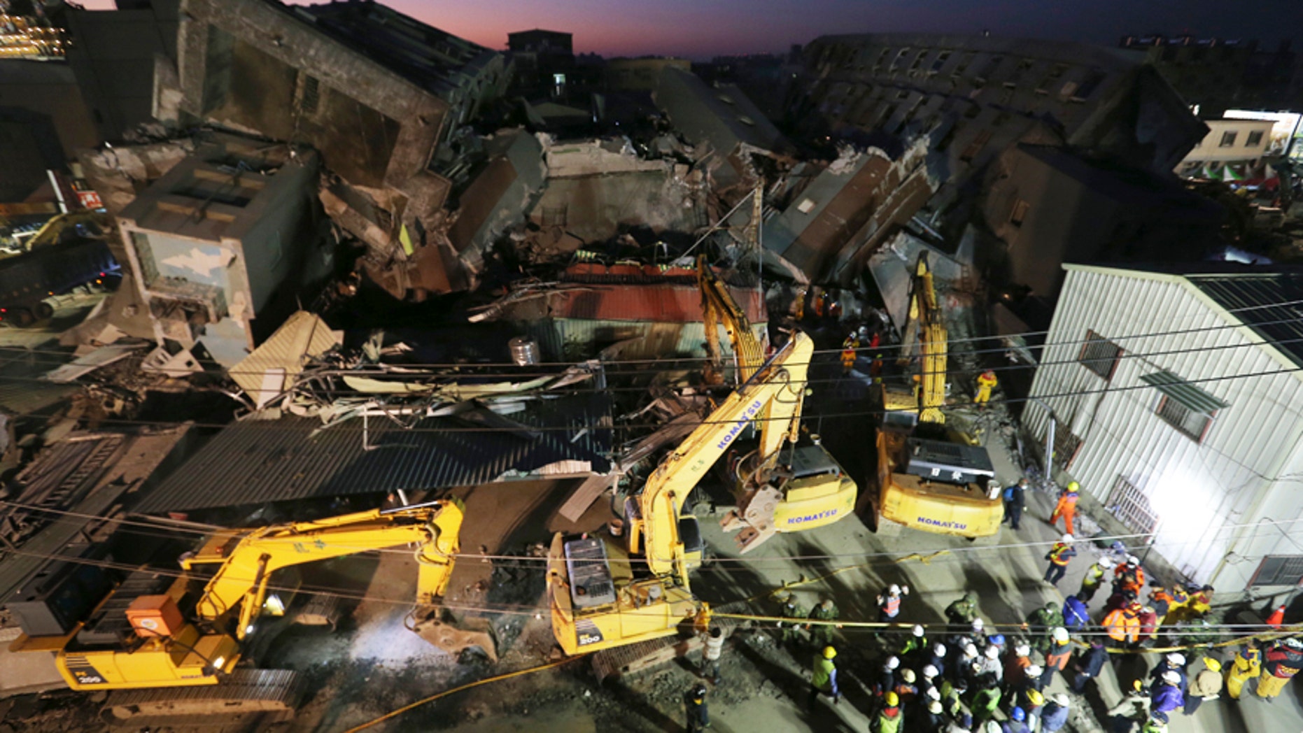 Feb. 8, 2016: Emergency rescue workers continue to search the rubble of a collapsed building complex in Tainan, Taiwan.