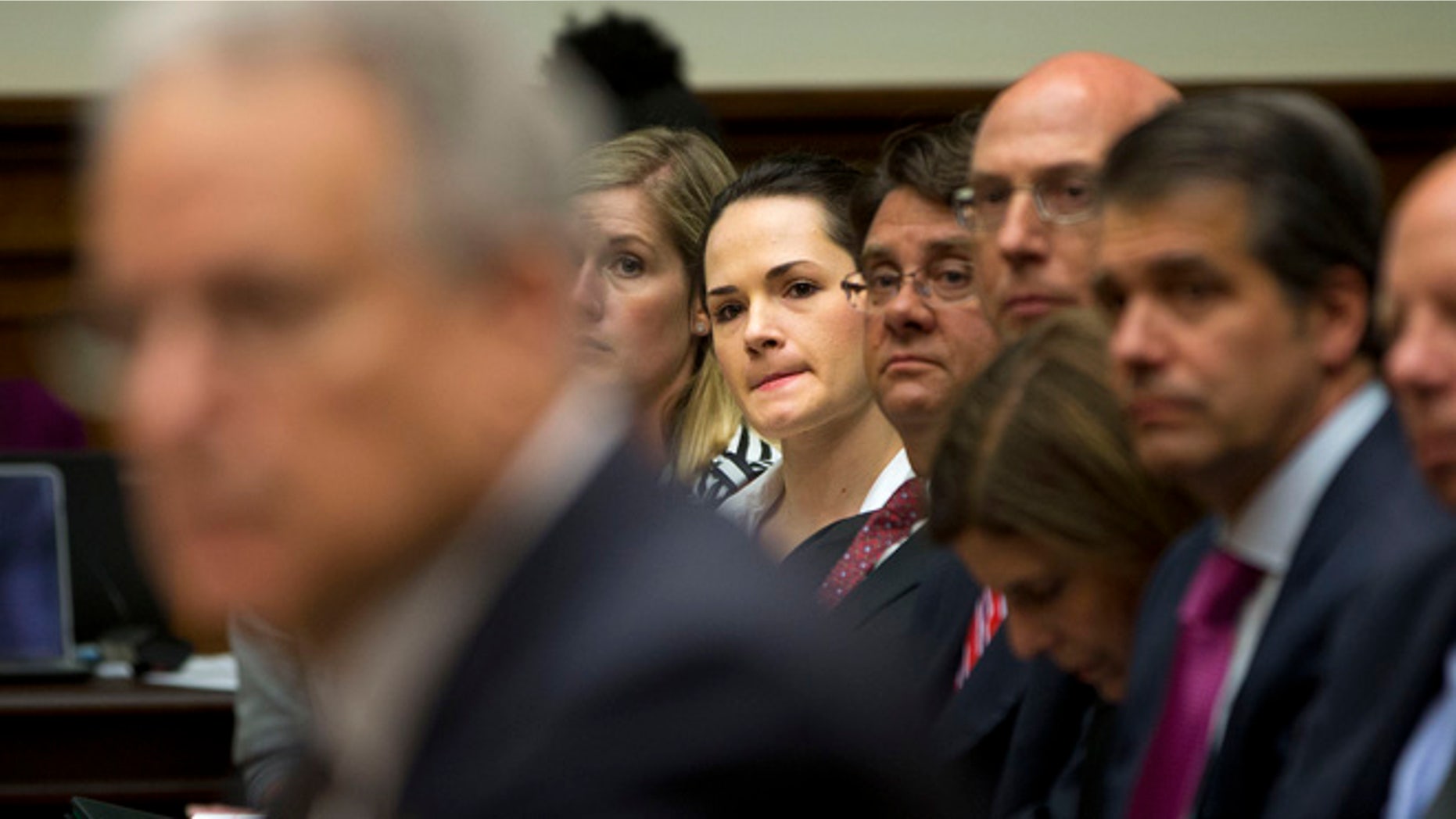 June 2, 2015: Angelina Sujata, center, a victim of a defective Takata airbag, listens to testimony on Capitol Hill in Washington.