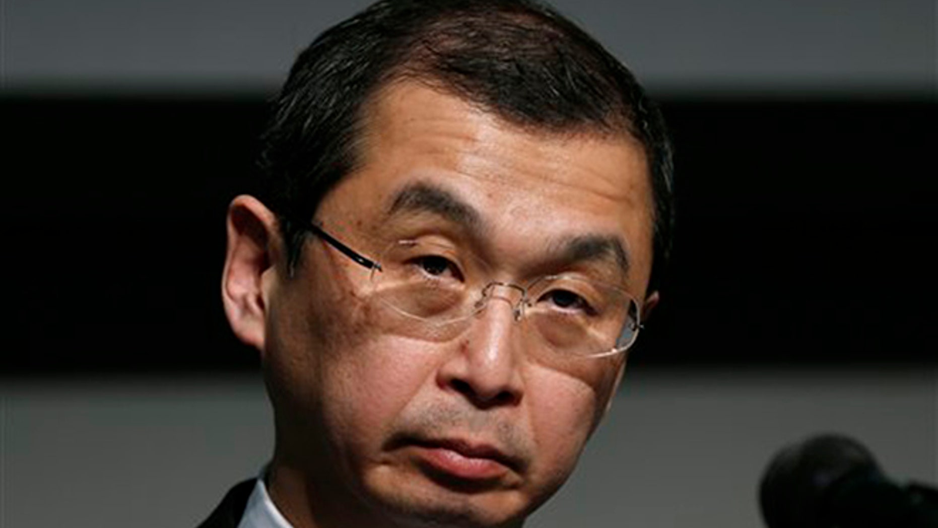 FILE - In this June 25, 2015, file photo, Japanese air bag maker Takata Corp. CEO Shigehisa Takada listens to a reporter's question during a news conference in Tokyo. (AP Photo/Shuji Kajiyama)