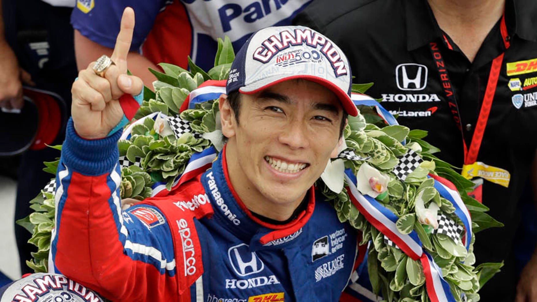 May 28, 2017: Takuma Sato, center, of Japan, celebrates after winning the Indianapolis 500 auto race at Indianapolis Motor Speedway in Indianapolis.