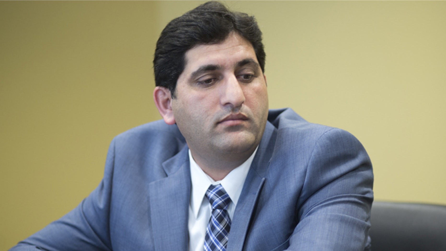 Sept. 8, 2014: Irfan Khan, a naturalized U.S. citizen from Pakistan, discusses his lawsuit against the U.S. government in his Plantation, Fla. office. (AP)