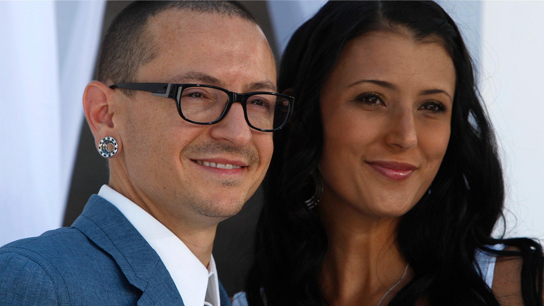 Chester Bennington of Linkin Park and wife Talinda arrive at the 2012 Billboard Music Awards in Las Vegas, Nevada, May 20, 2012.