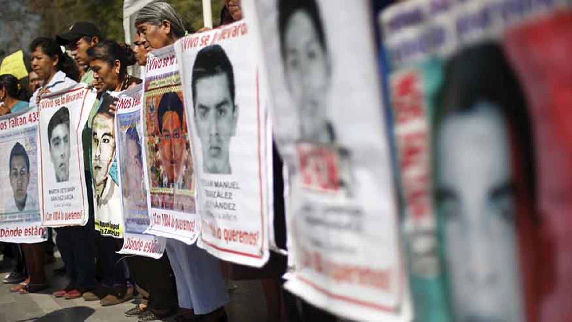 Relatives of the 43 students missing from Ayotzinapa take part in a demonstration in Mexico City, on Feb. 22, 2016.
