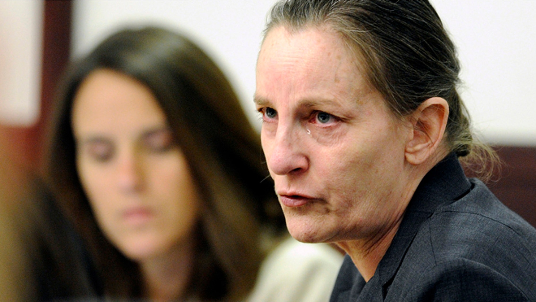 May 6, 2014: Julie Schenecker talks with attorney Jennifer Spradley on prior to the start of day 2 of her trial in Tampa, Fla.