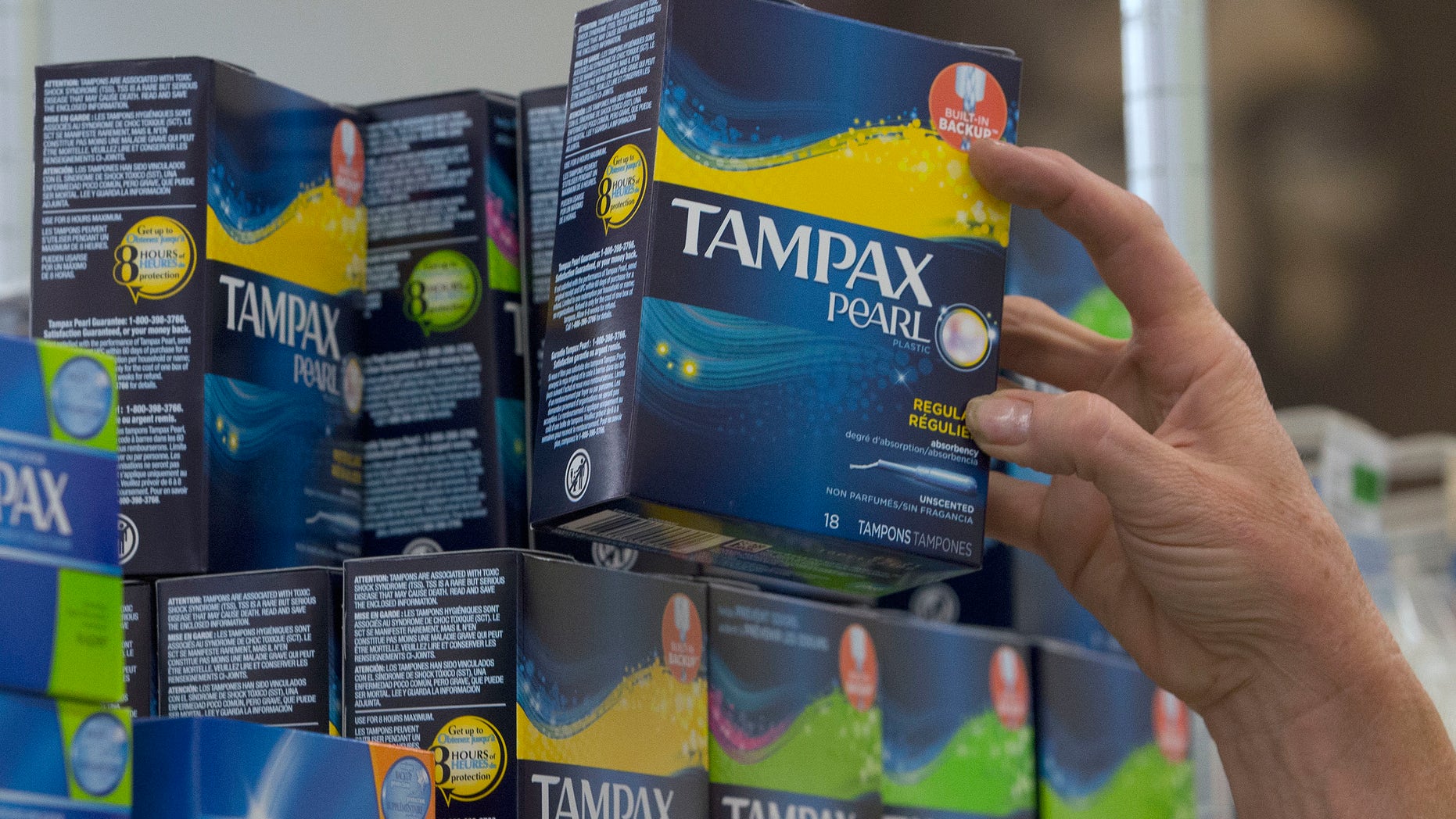 June 22, 2016: Tammy Compton restocks tampons at Compton's Market, in Sacramento, Calif.