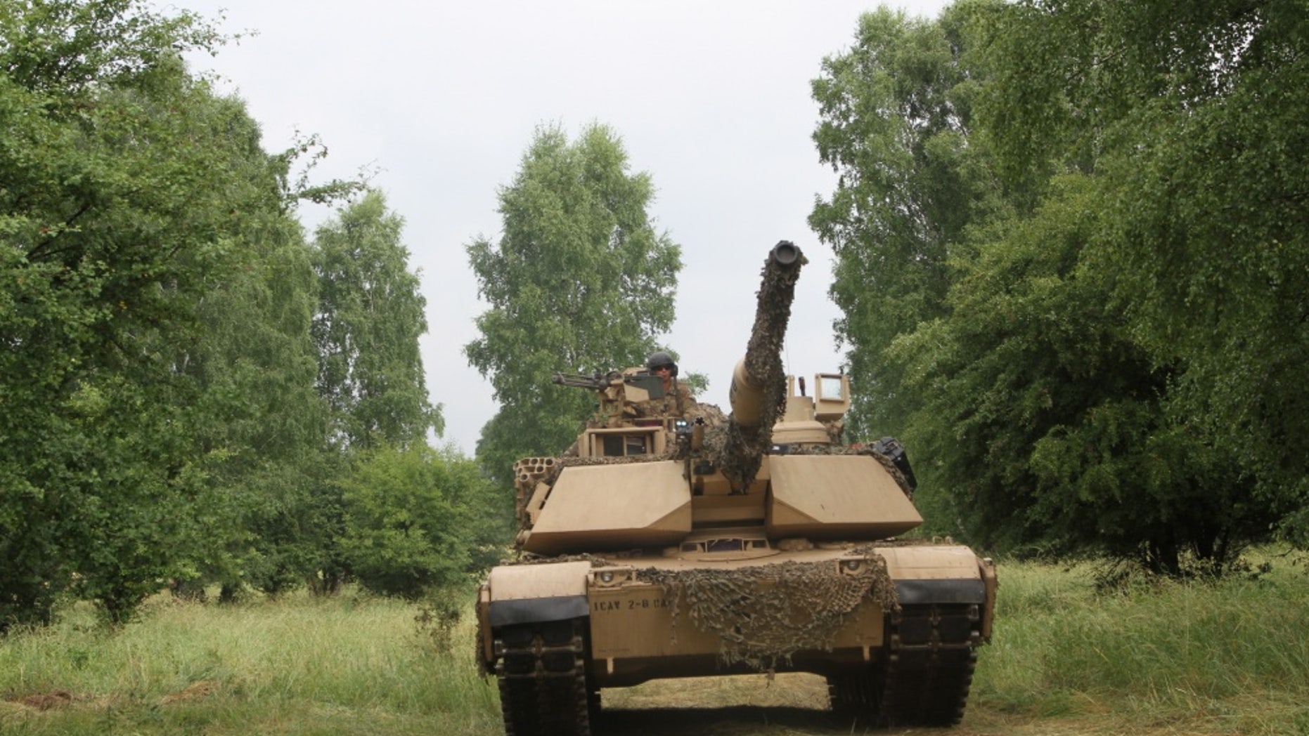 File photo - Tank crewmen from Bravo Company “Eager Arms”, 2nd Battalion, 8th Regiment, 1st Armored Brigade Combat Team, 1st Cavalry Division maneuver a M1A2 Abrams tank during their company-level situational training exercise in preparation for Saber Strike in Drawsko Pomorskie Training Area, Poland, on June 12, 2018. (U.S. Army National Guard photo by Staff Sgt. Ron Lee, 382nd Public Affairs Detachment, 1ABCT, 1CD/Released)
