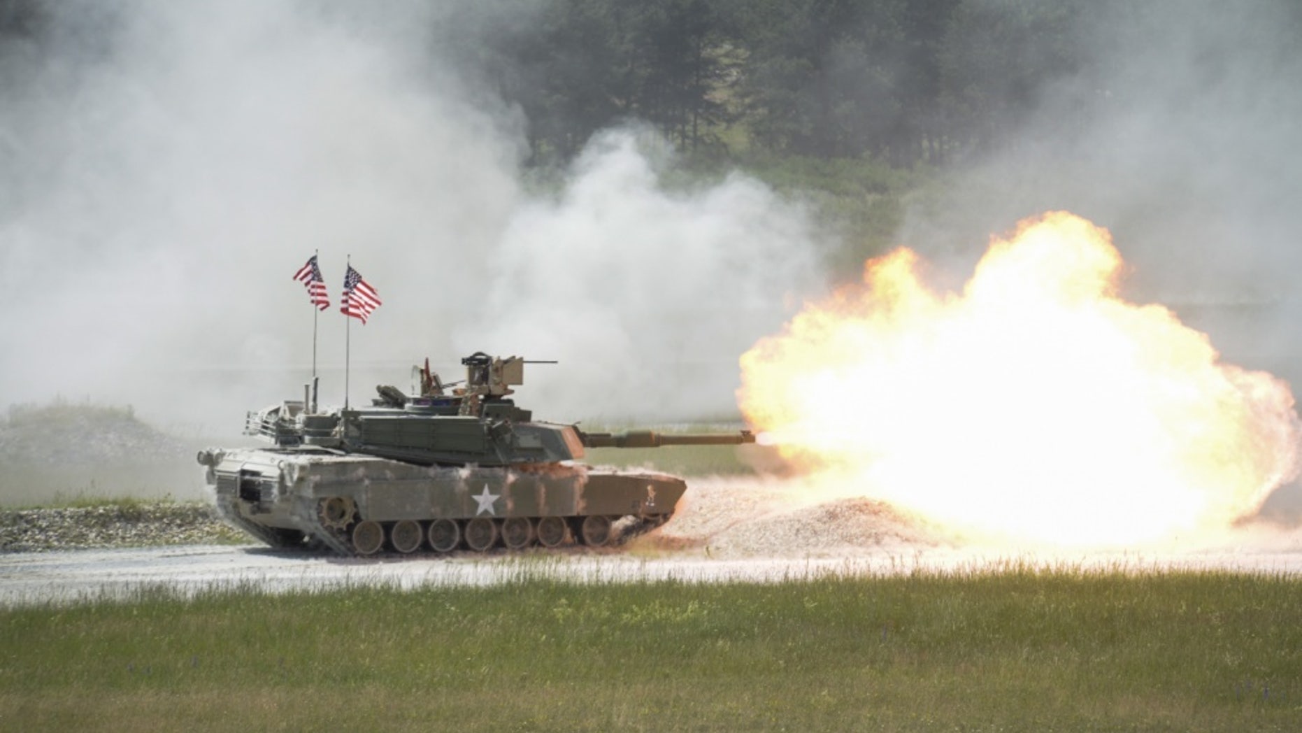 File photo - A United States M1A2 SEP fires it's main gun during the shoot-off of Strong Europe Tank Challenge.U.S. Army Europe and the German Army co-host the third Strong Europe Tank Challenge at Grafenwoehr Training Area, June 3 - 8, 2018. U.S. Army Photo by Kevin S. Abel)