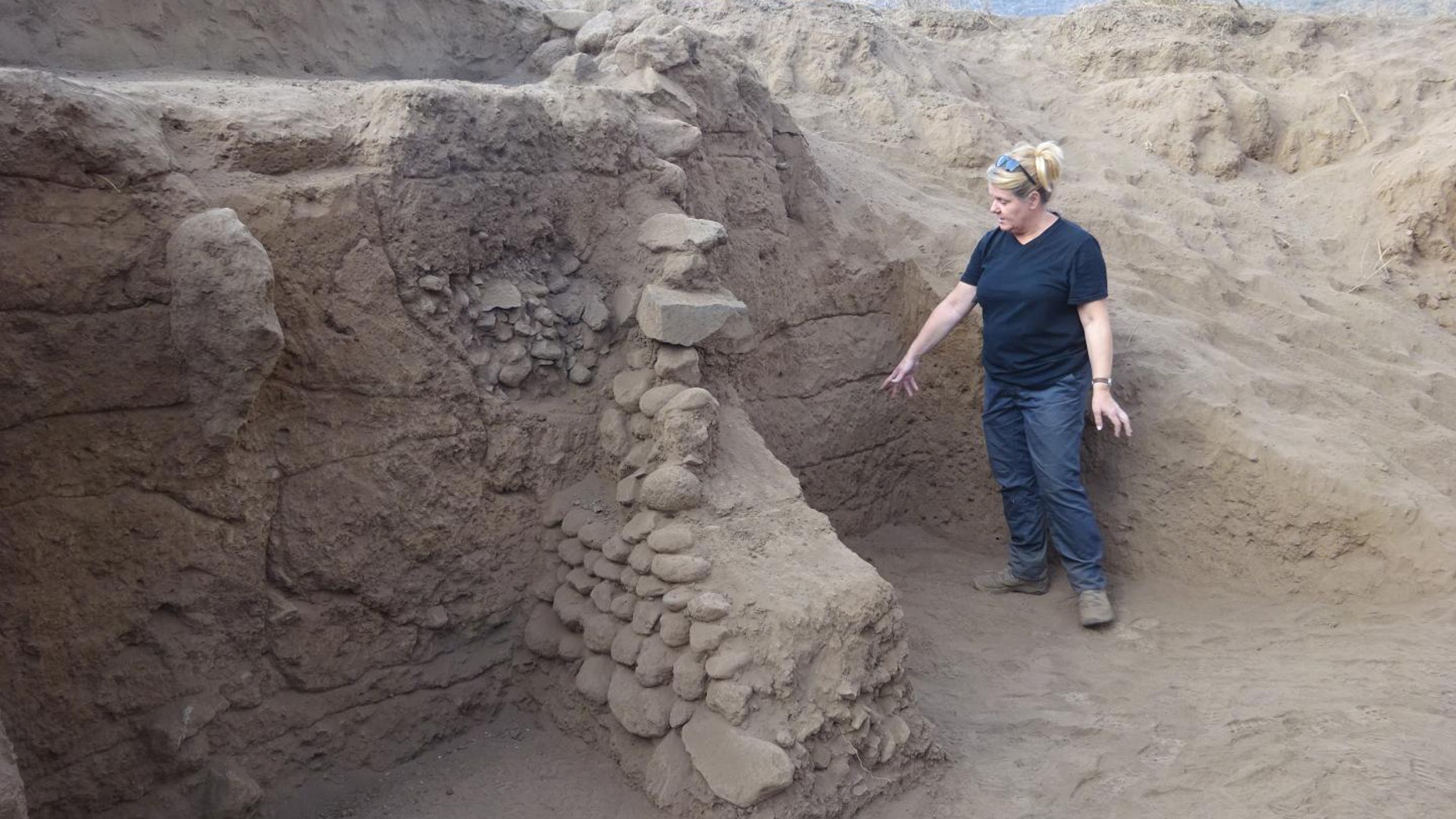 Carol Lang, University of York, examines the terrace systems of Engaruka. (University of York)